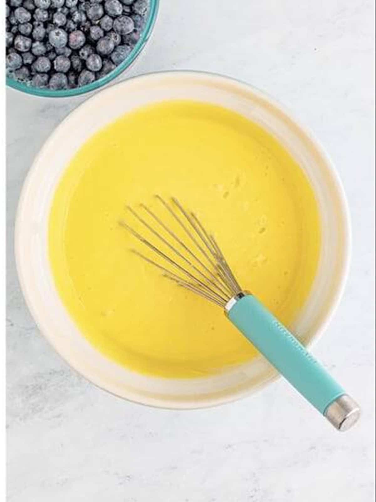 French vanilla pudding whisked thick in a bowl.