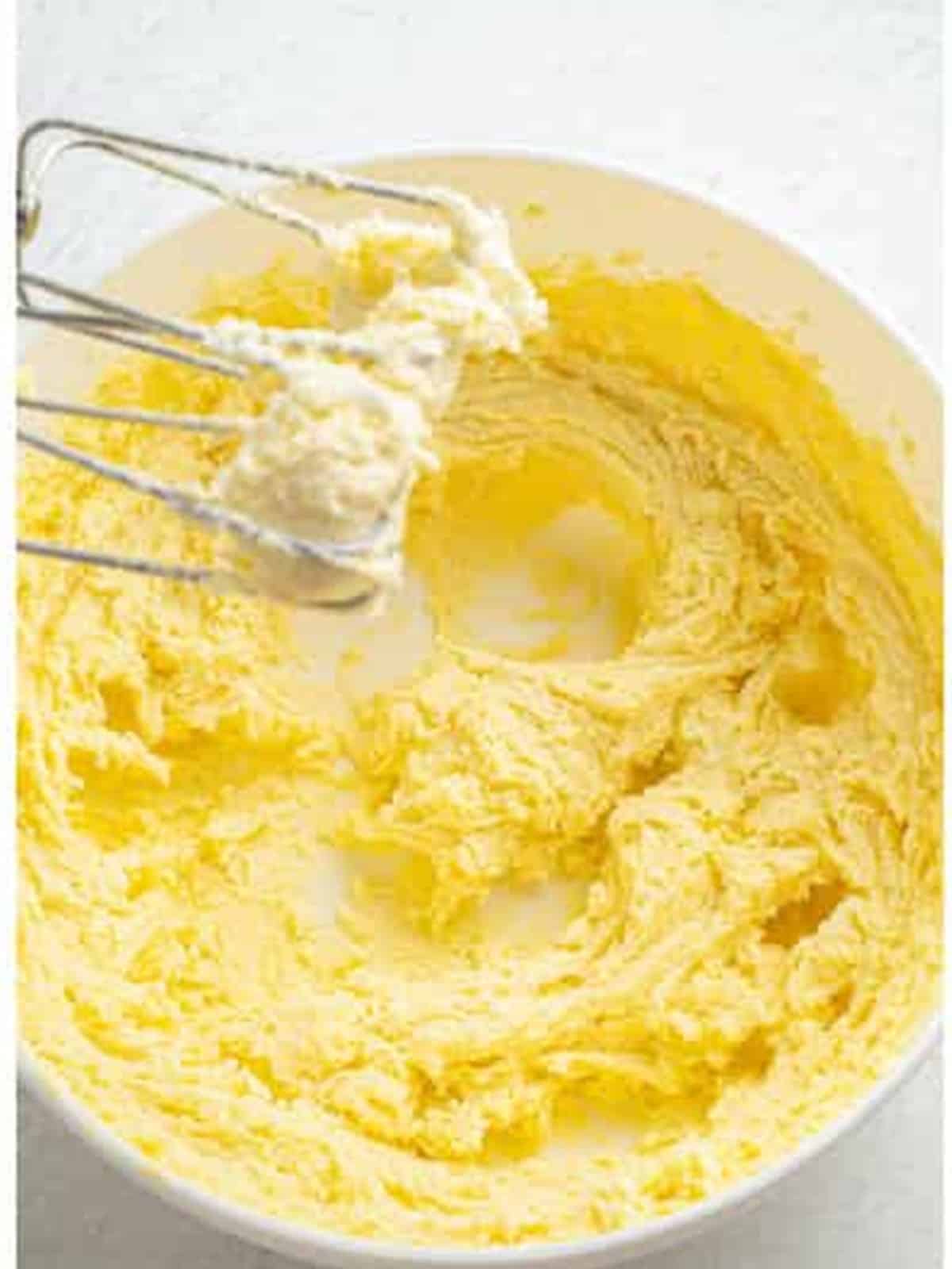 Creaming butter and sugar in a bowl for lemon brownies.