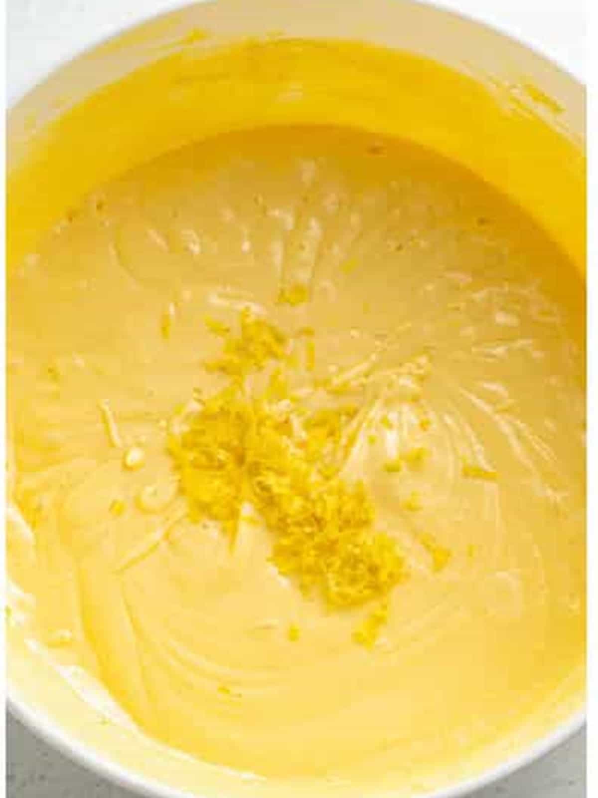 Stirring fresh lemon juice and zest into the brownie batter.