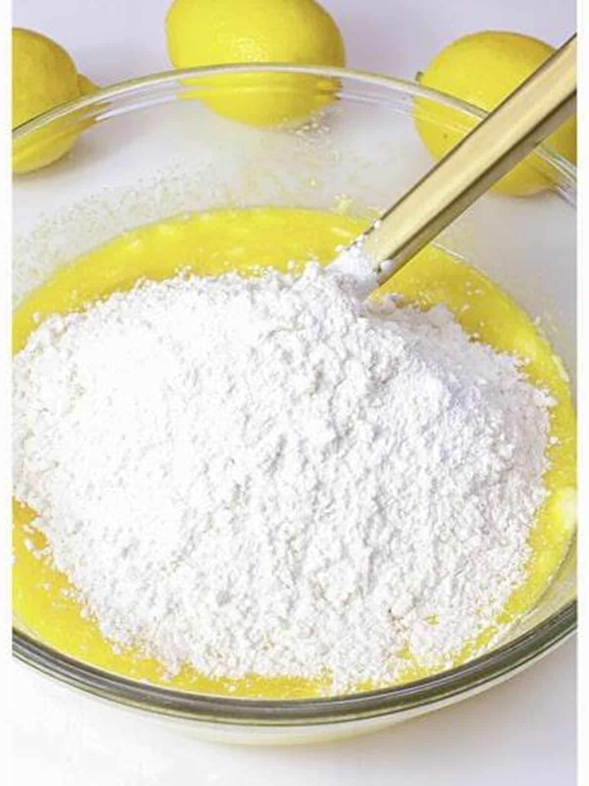 Powdered sugar added to make lemon cream cheese frosting.