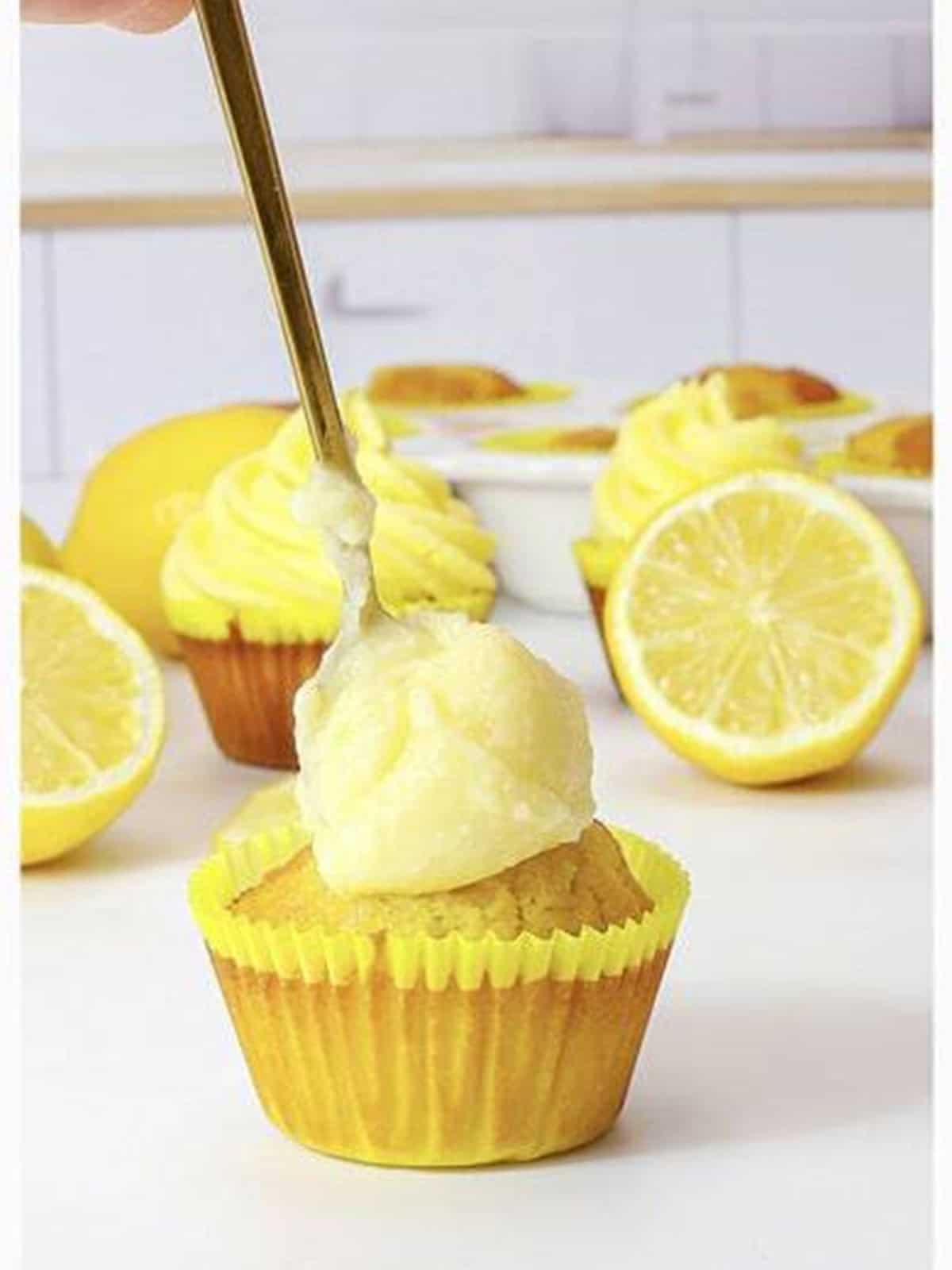 A baked lemon cupcake filled with cheesecake pudding.