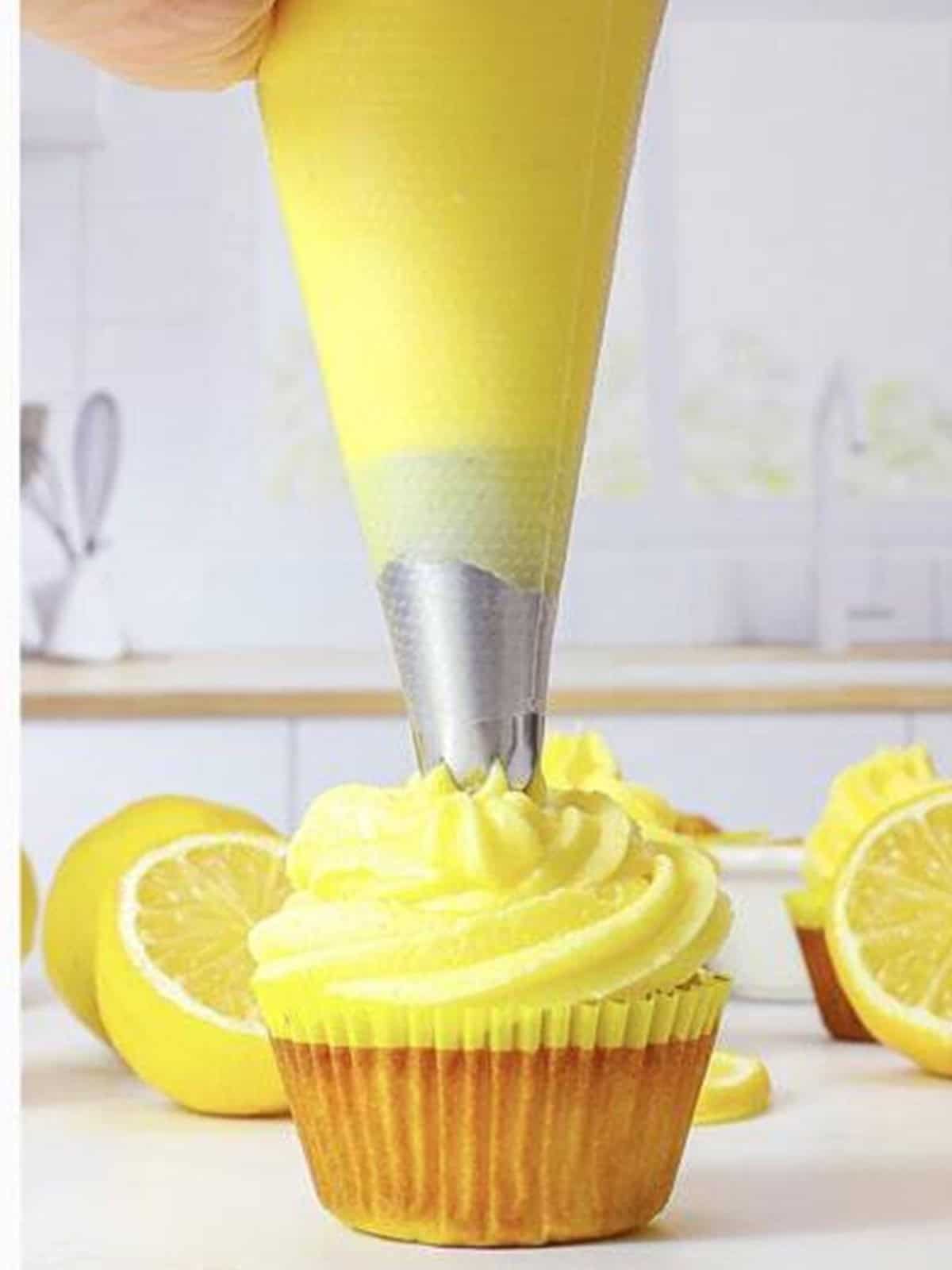 Lemon cream cheese frosting piped onto a cupcake.