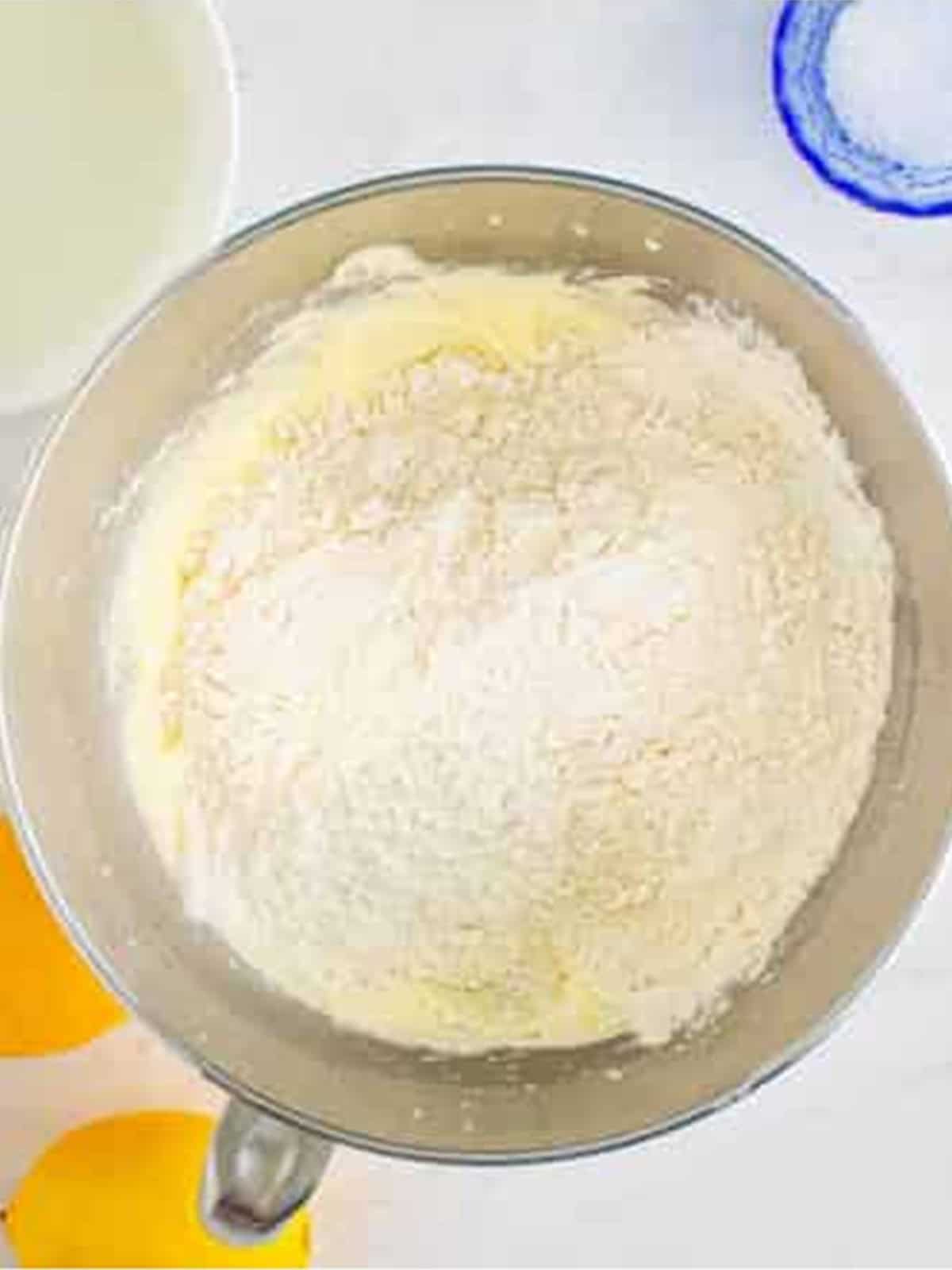 Adding the flour mixture to the creamed butter and eggs.