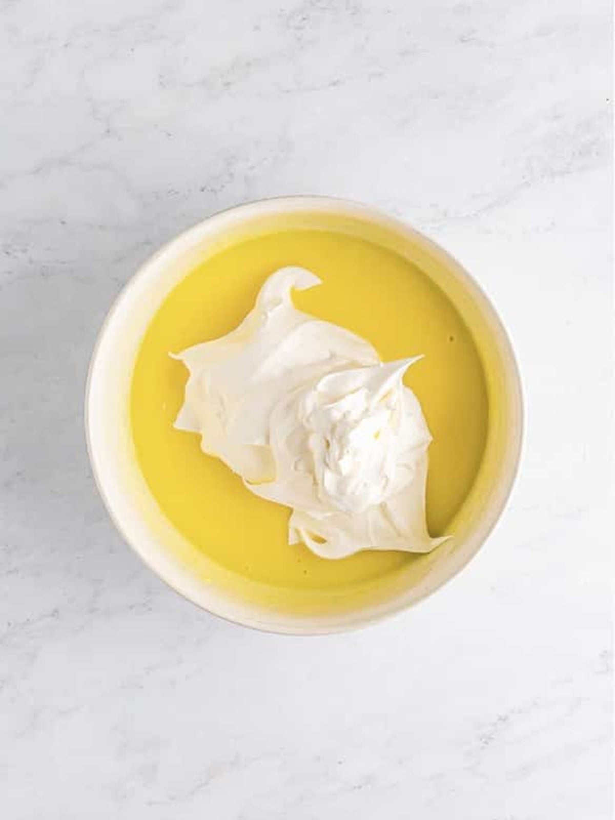Whipped topping folded into the limoncello lemon pudding until smooth and creamy.