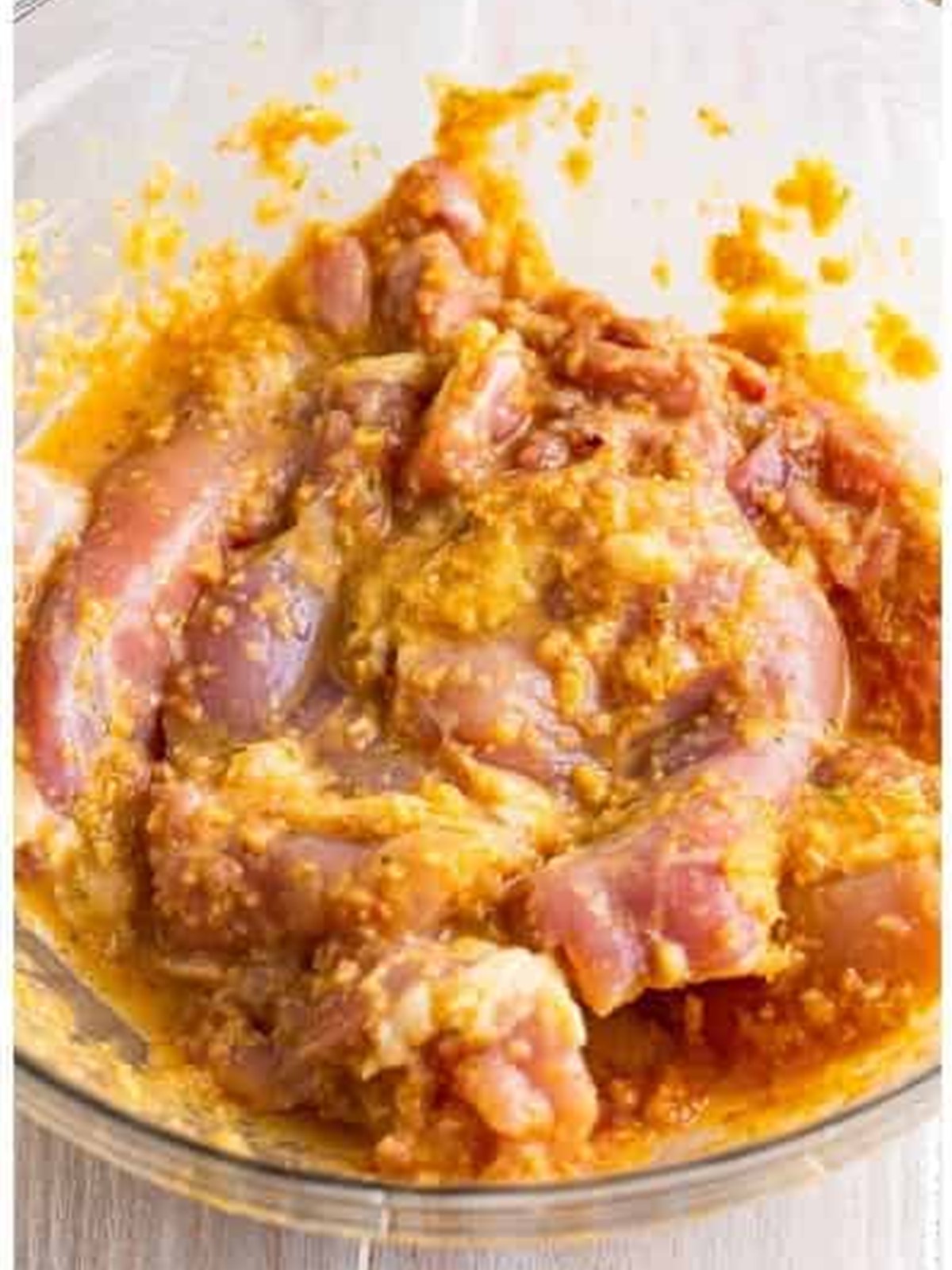 Chicken thighs tossed in lemongrass marinade ready to chill.