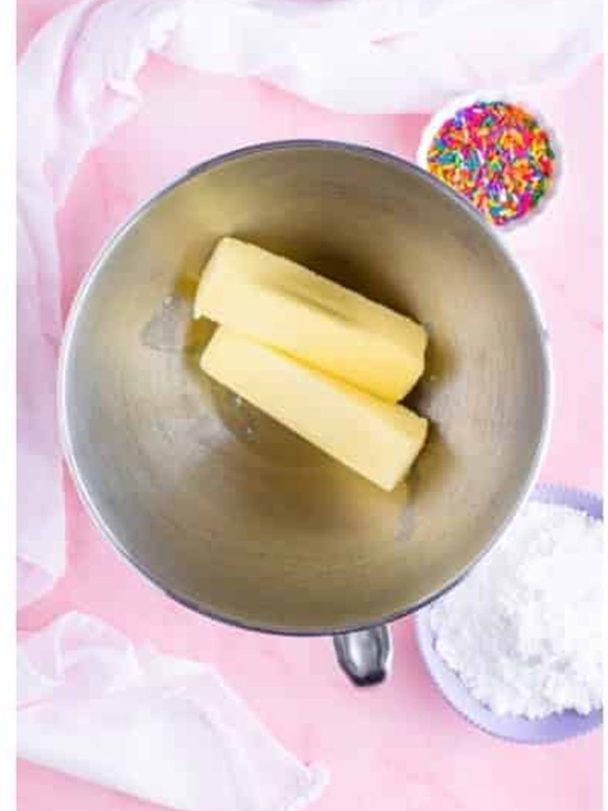 Softened butter creaming in a stand mixer bowl for lofthouse cookies.