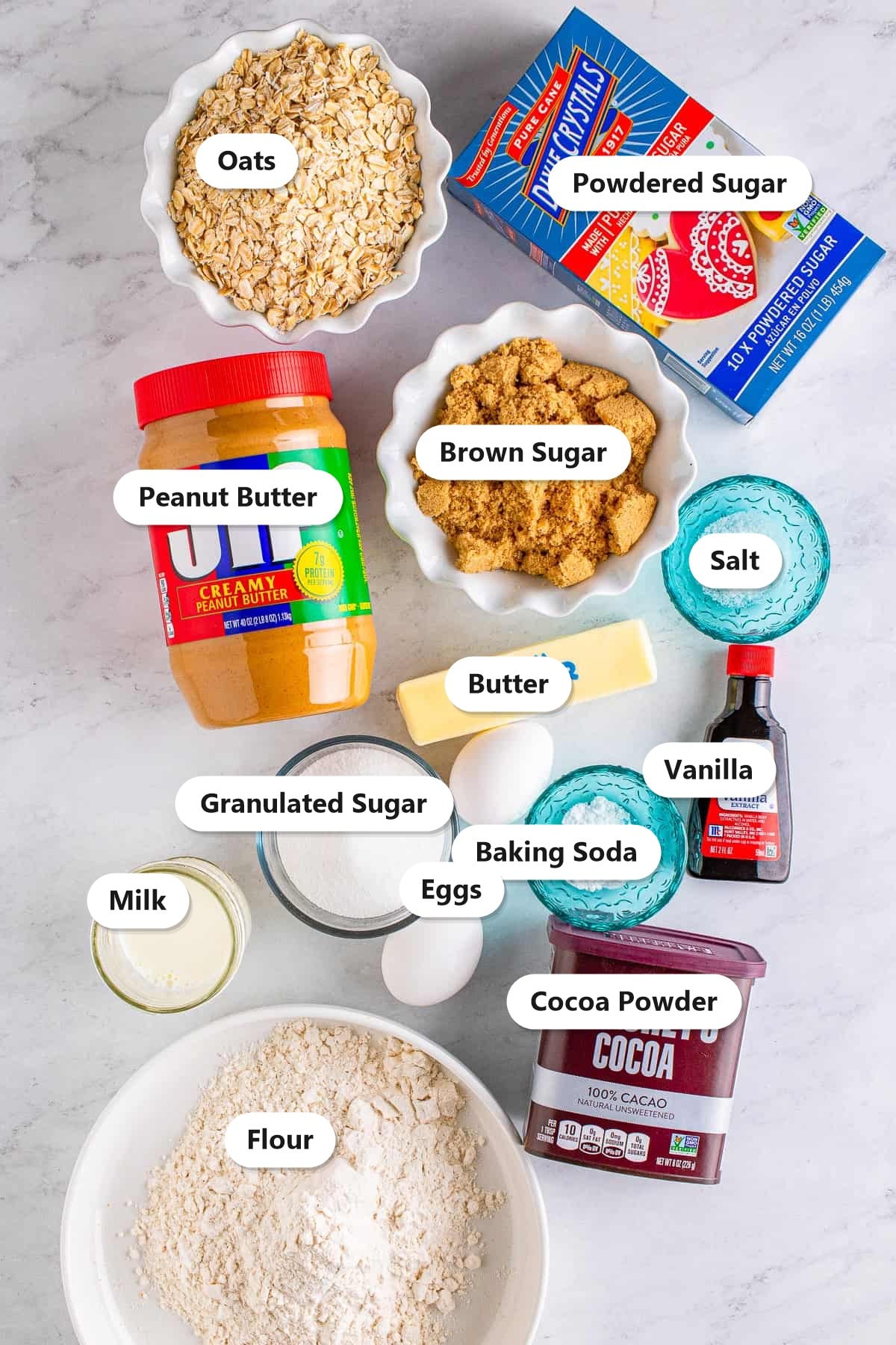 Labeled ingredients for lunch lady peanut butter bars including oats, flour, peanut butter, brown sugar, butter, eggs, cocoa powder, and powdered sugar.