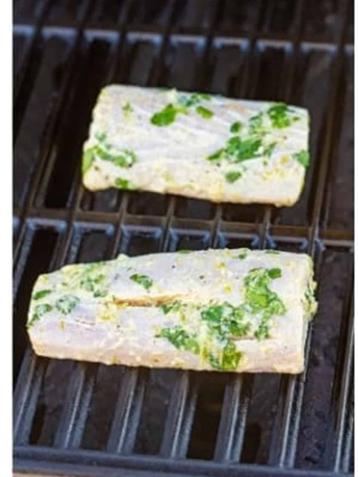 Marinated mahi filets on the grill for mahi mahi fish tacos.