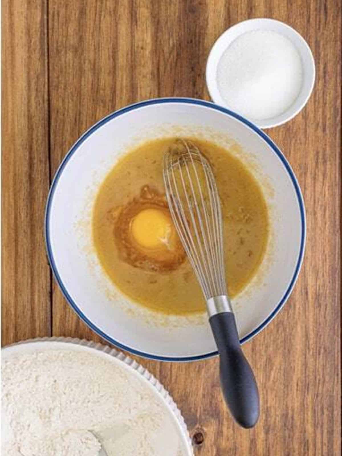 An egg whisked into the butter and brown sugar mixture.