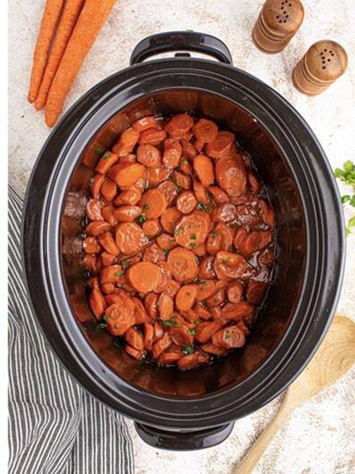 Tender maple glazed carrots cooked in a slow cooker.