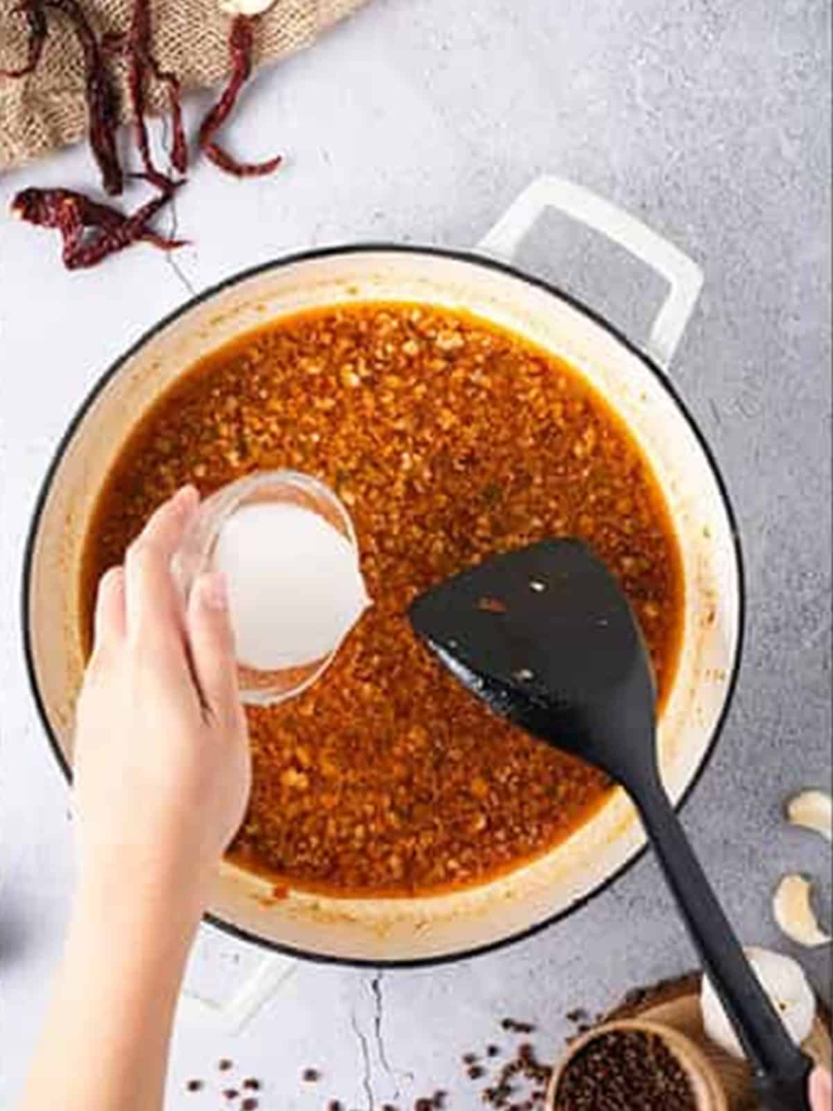 Cornstarch slurry stirred into the Mapo Tofu sauce to thicken it.
