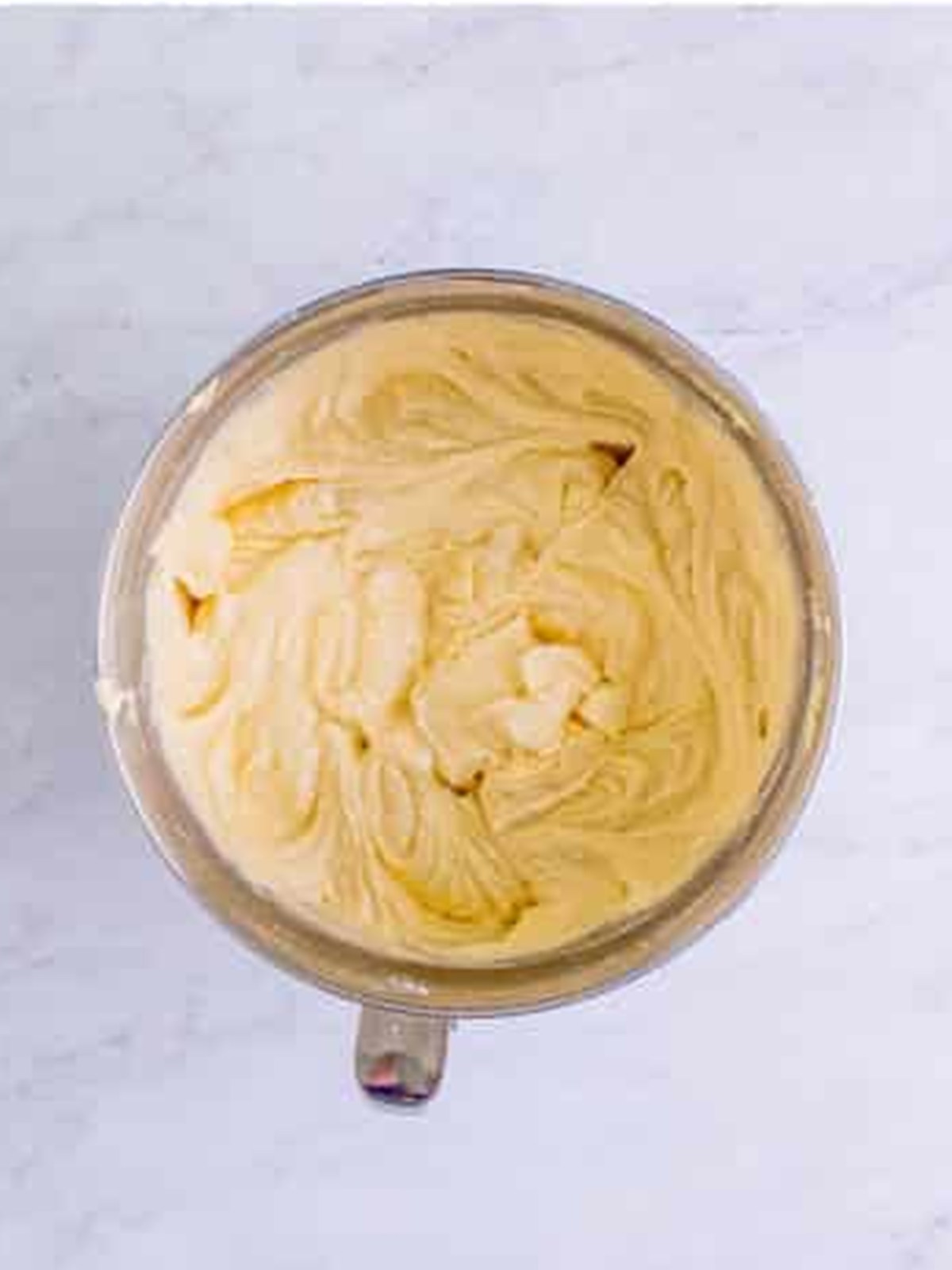 Yellow marble cake batter mixed in a bowl