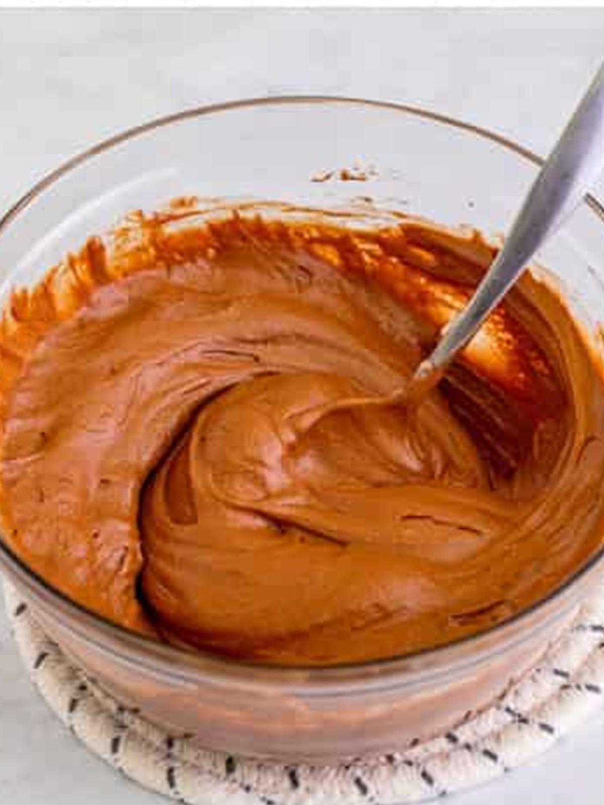 Chocolate cake batter stirred together in a bowl