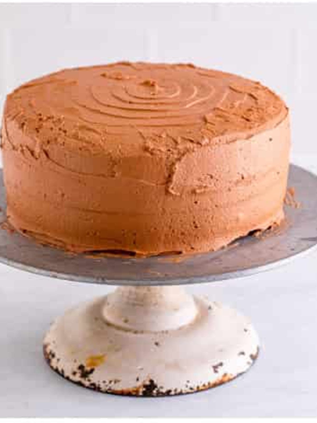 Frosted marble cake on a cake stand