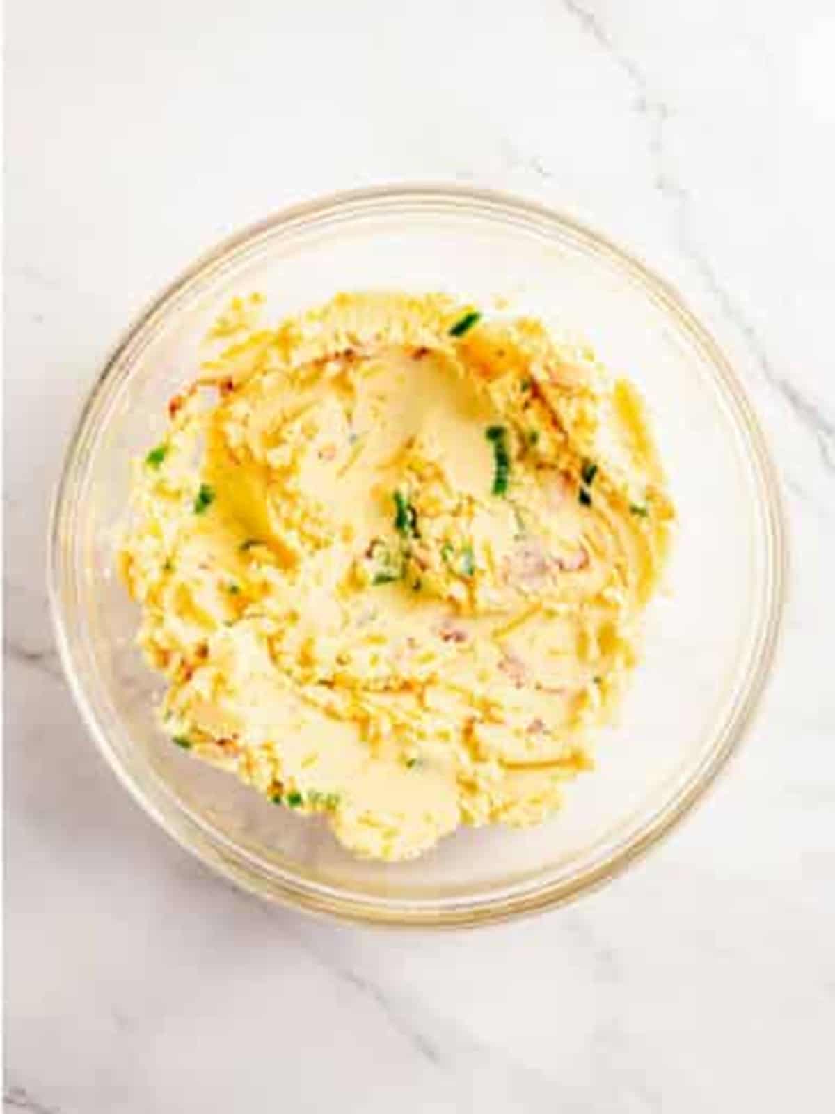 Bacon, cheddar cheese, and scallions mixed into the mashed potatoes.