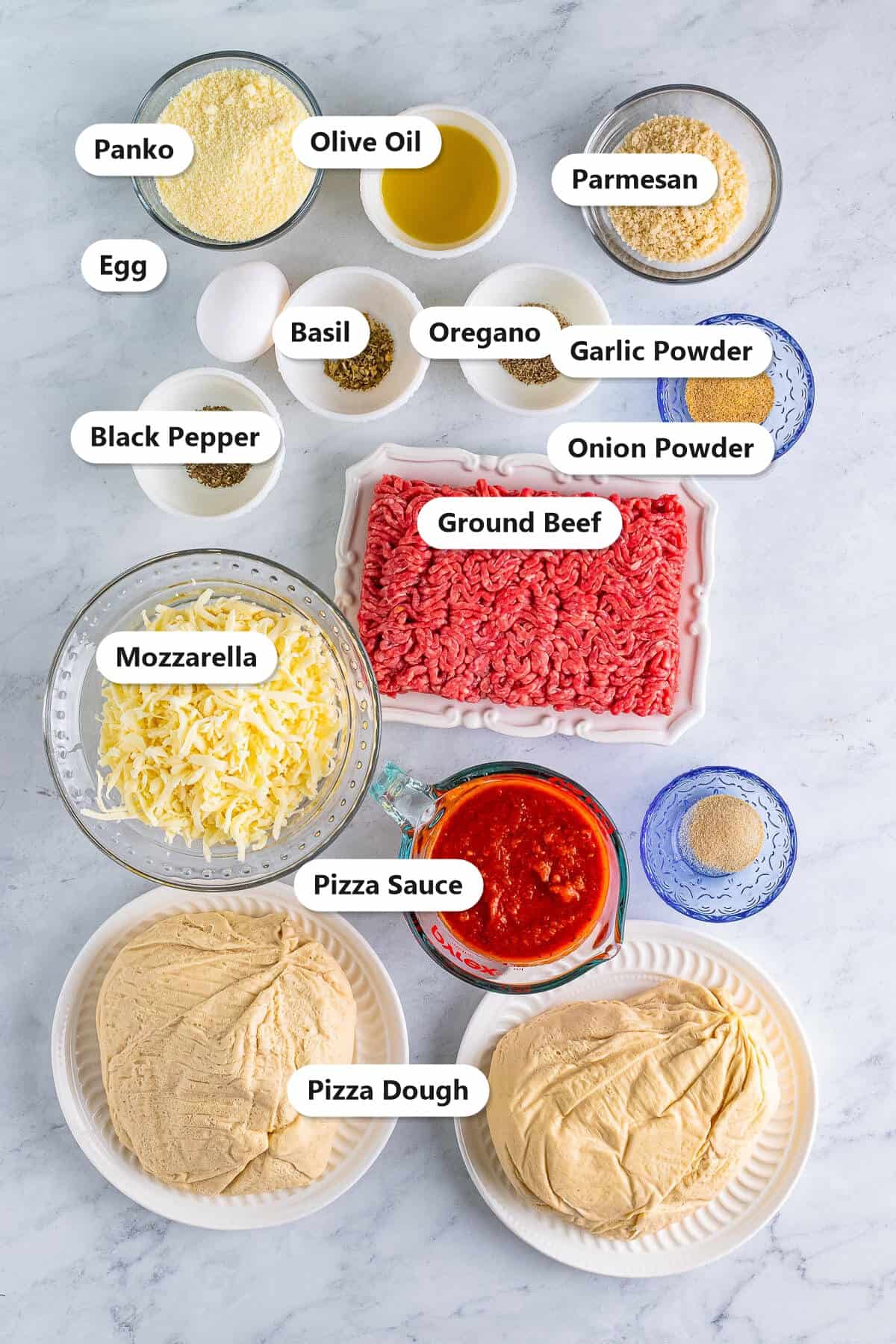 Labeled ingredients for meatball pizza including ground beef, pizza dough, mozzarella, parmesan, pizza sauce, and seasonings.