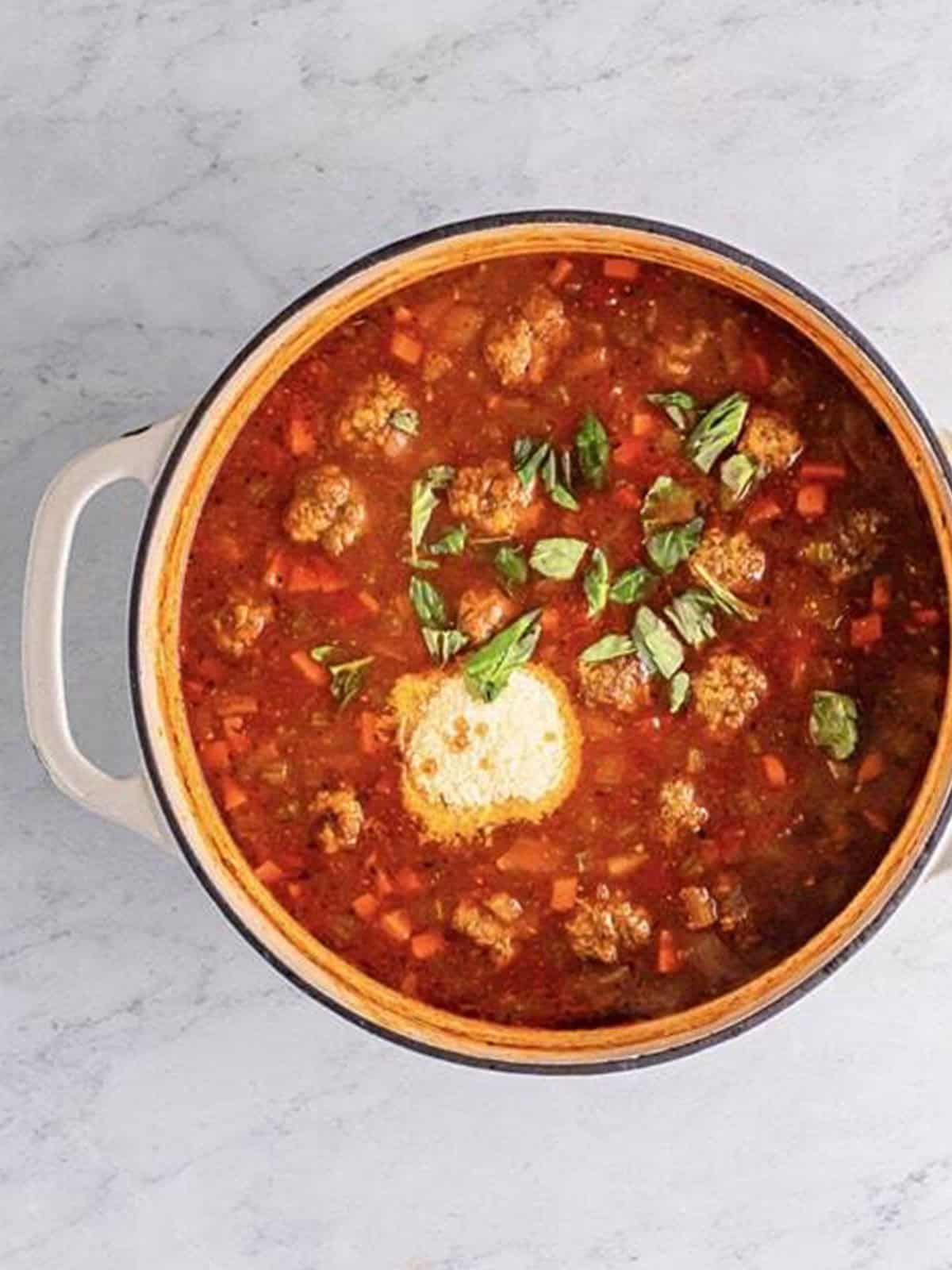 Ditalini pasta and meatballs simmering in Italian meatball soup.