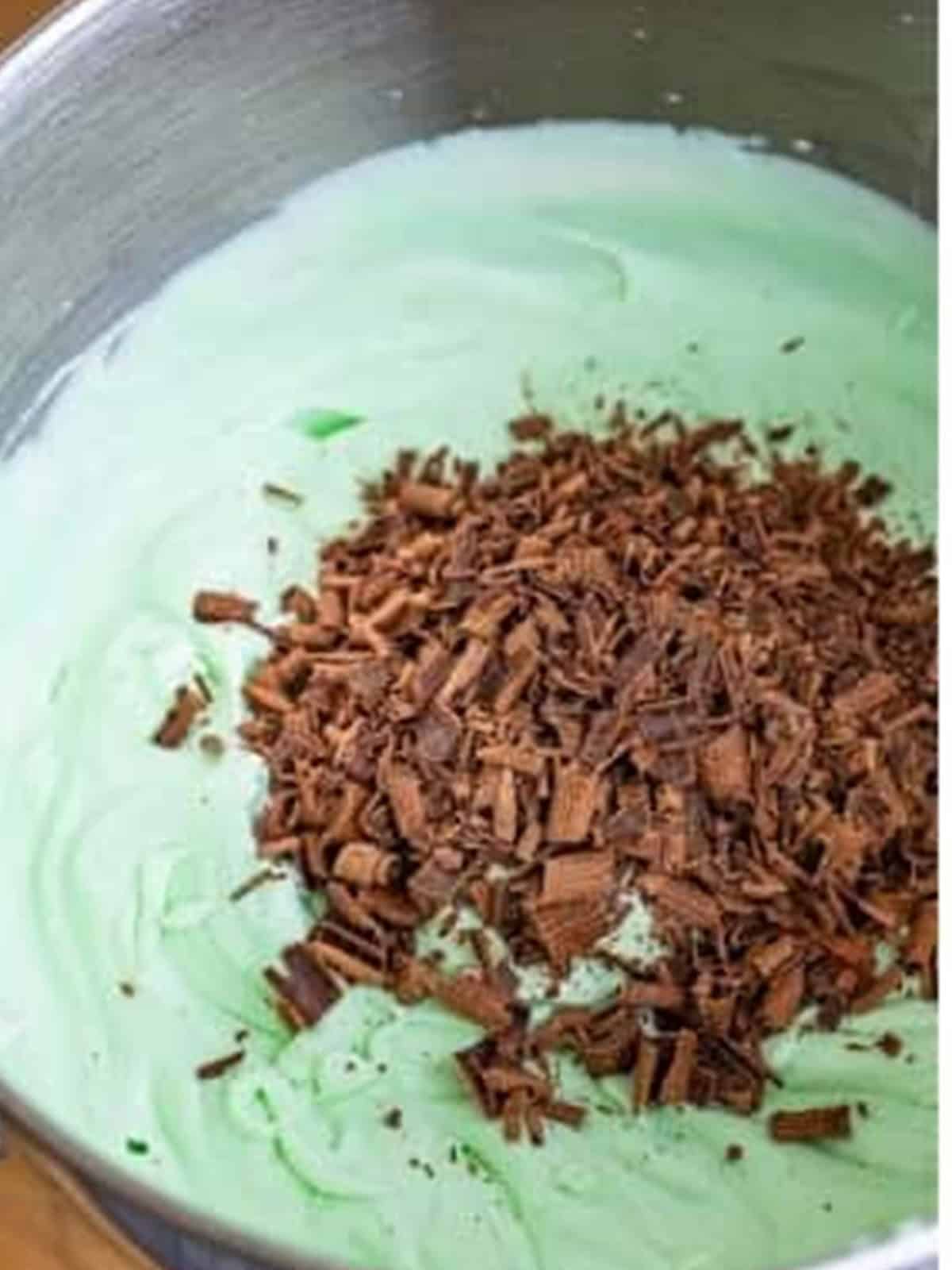 Chocolate shavings folded into the green mint ice cream base.