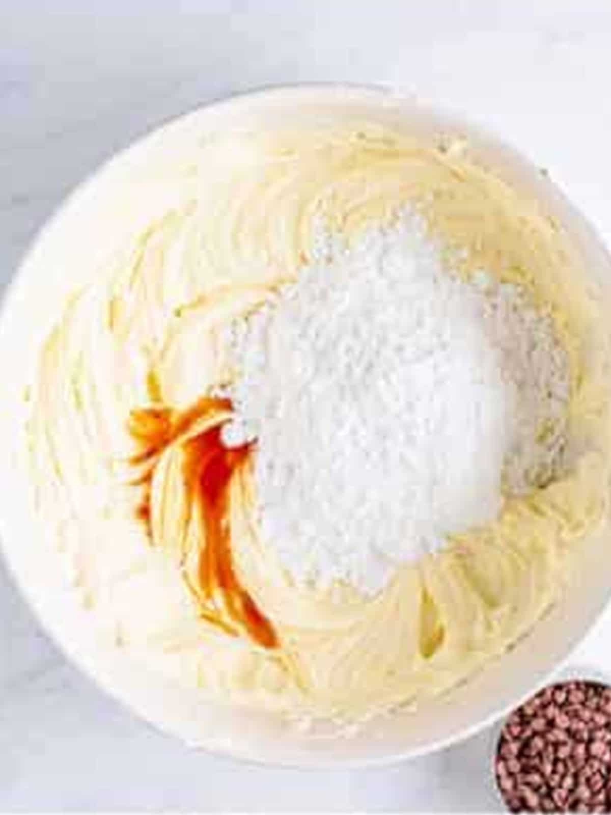 Powdered sugar, vanilla, and peppermint extract added to the whipped cream cheese.