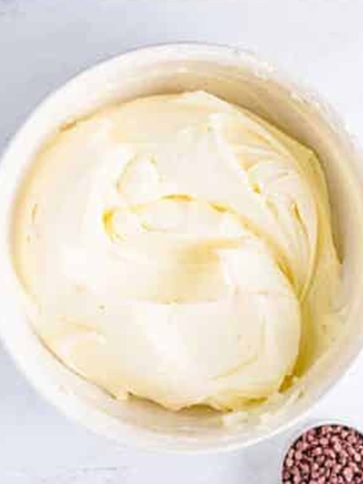 Whipped cream being folded into the mint cheesecake filling.