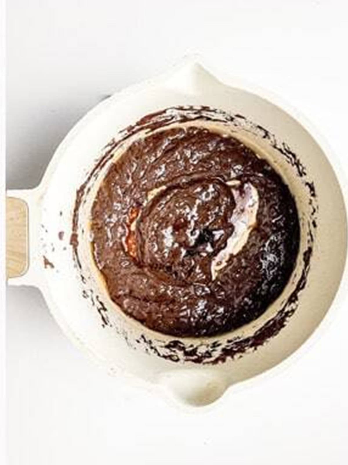 Chocolate sauce made with cocoa, butter, and milk in a saucepan.