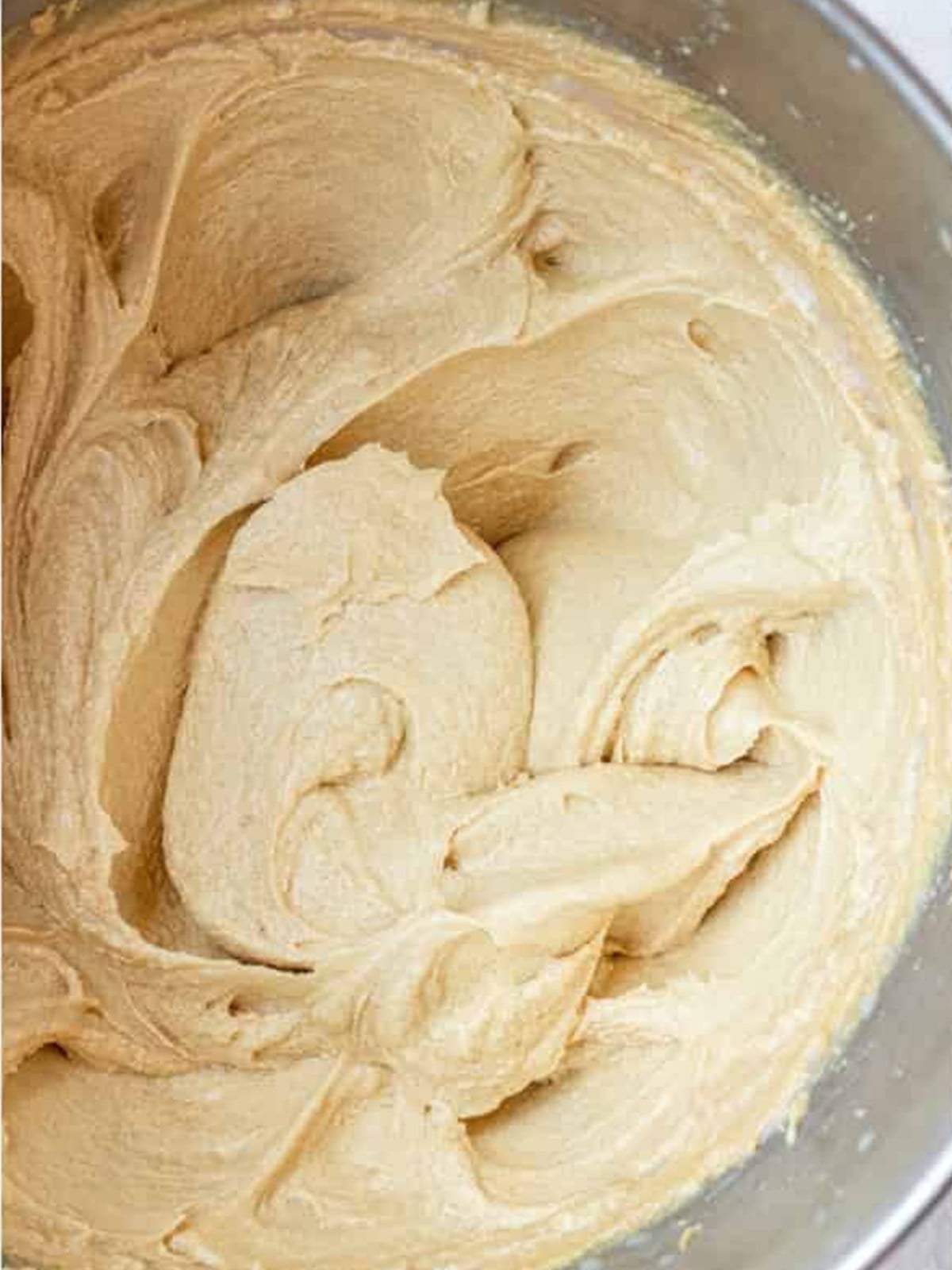 Butter and peanut butter creamed with sugars and eggs into a smooth cookie dough.