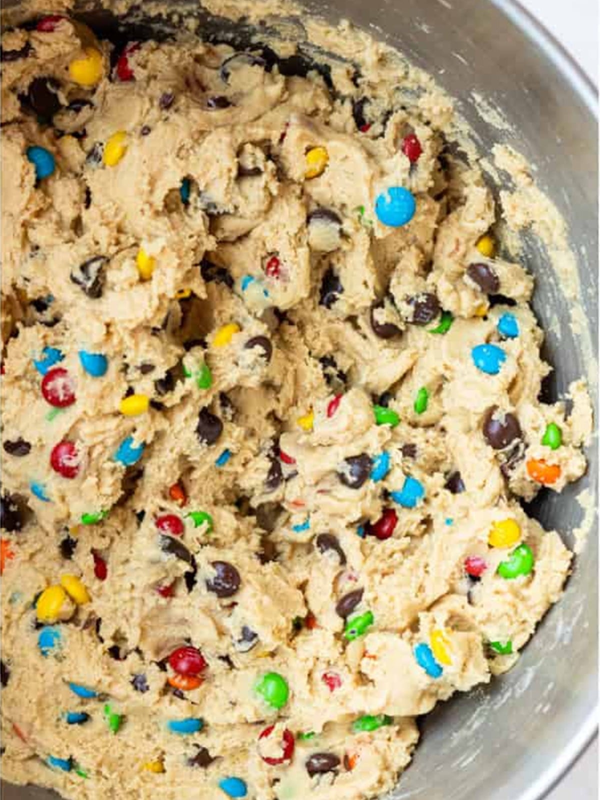 Mini M and Ms and chocolate chips folded into the peanut butter cookie dough.
