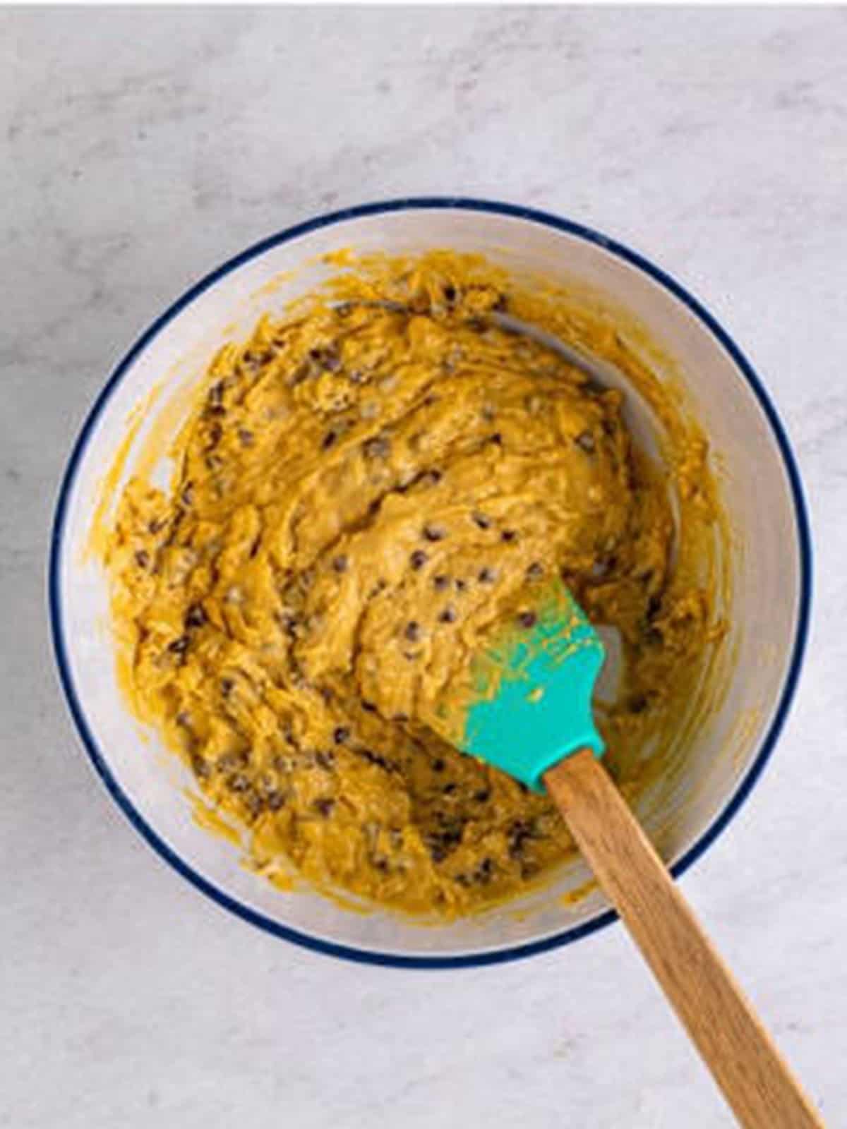 Flour mixture and chocolate chips stirred into the monster cookie batter.