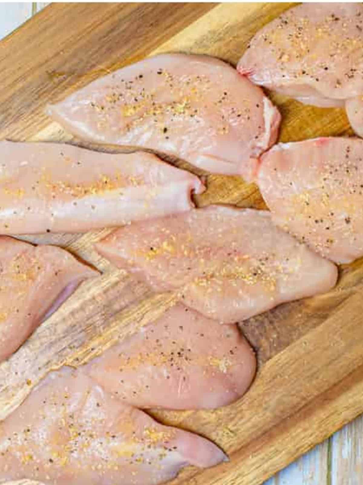 Chicken breasts sliced thin and seasoned with garlic powder, onion powder, salt, and pepper.