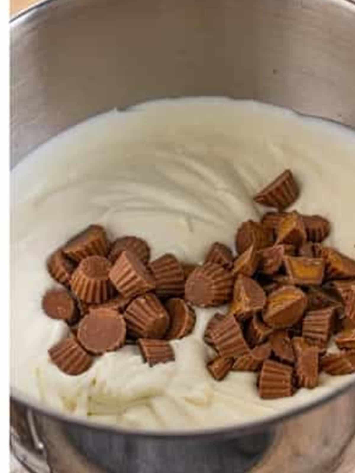 Mini peanut butter cups folded into the no churn ice cream base.