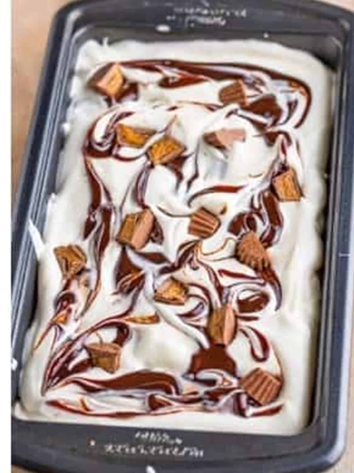 Finished no churn moose tracks ice cream topped with peanut butter cups before freezing.
