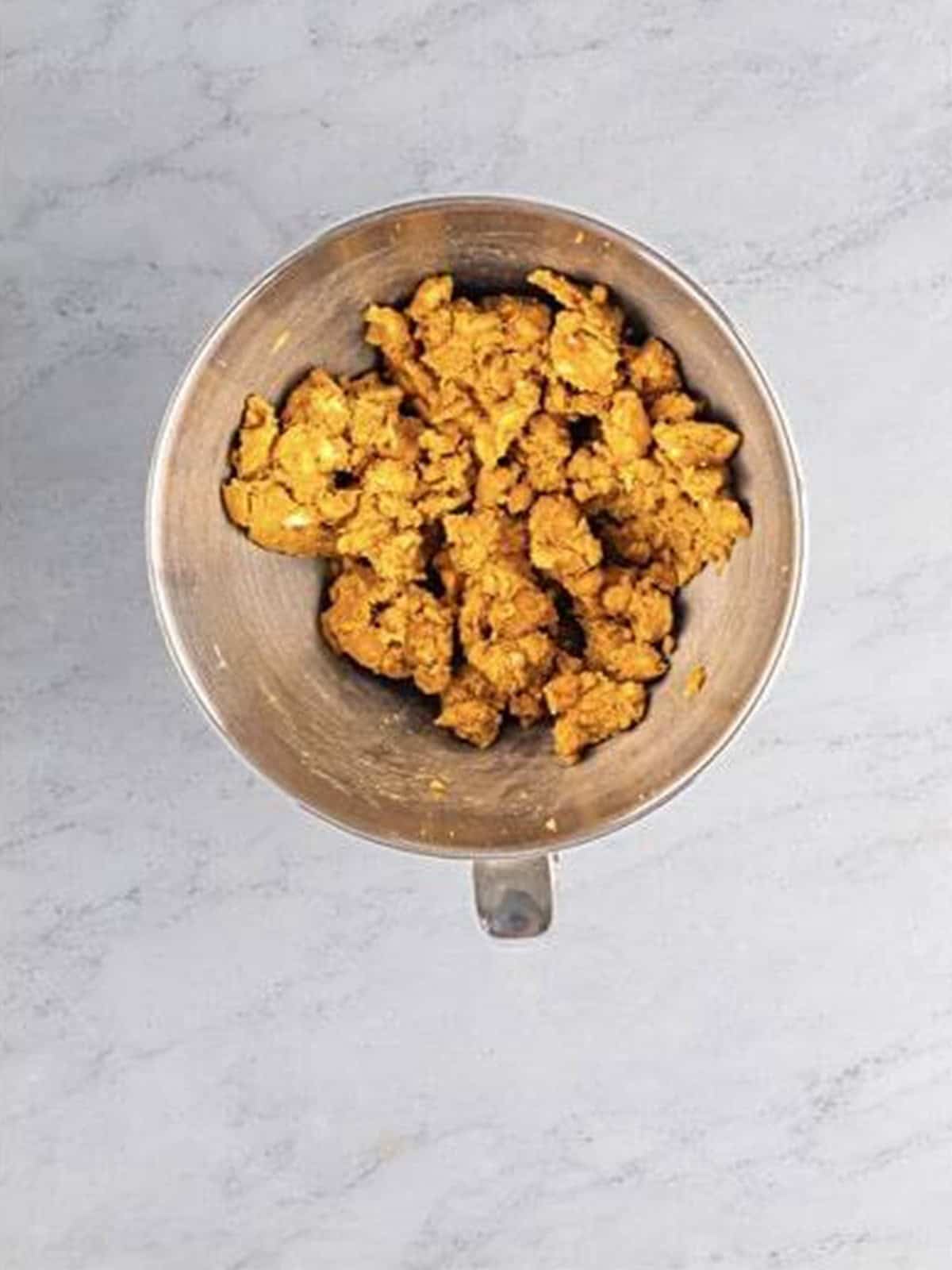 Cold cubed butter creamed with brown and granulated sugar into a sandy texture in a mixer.