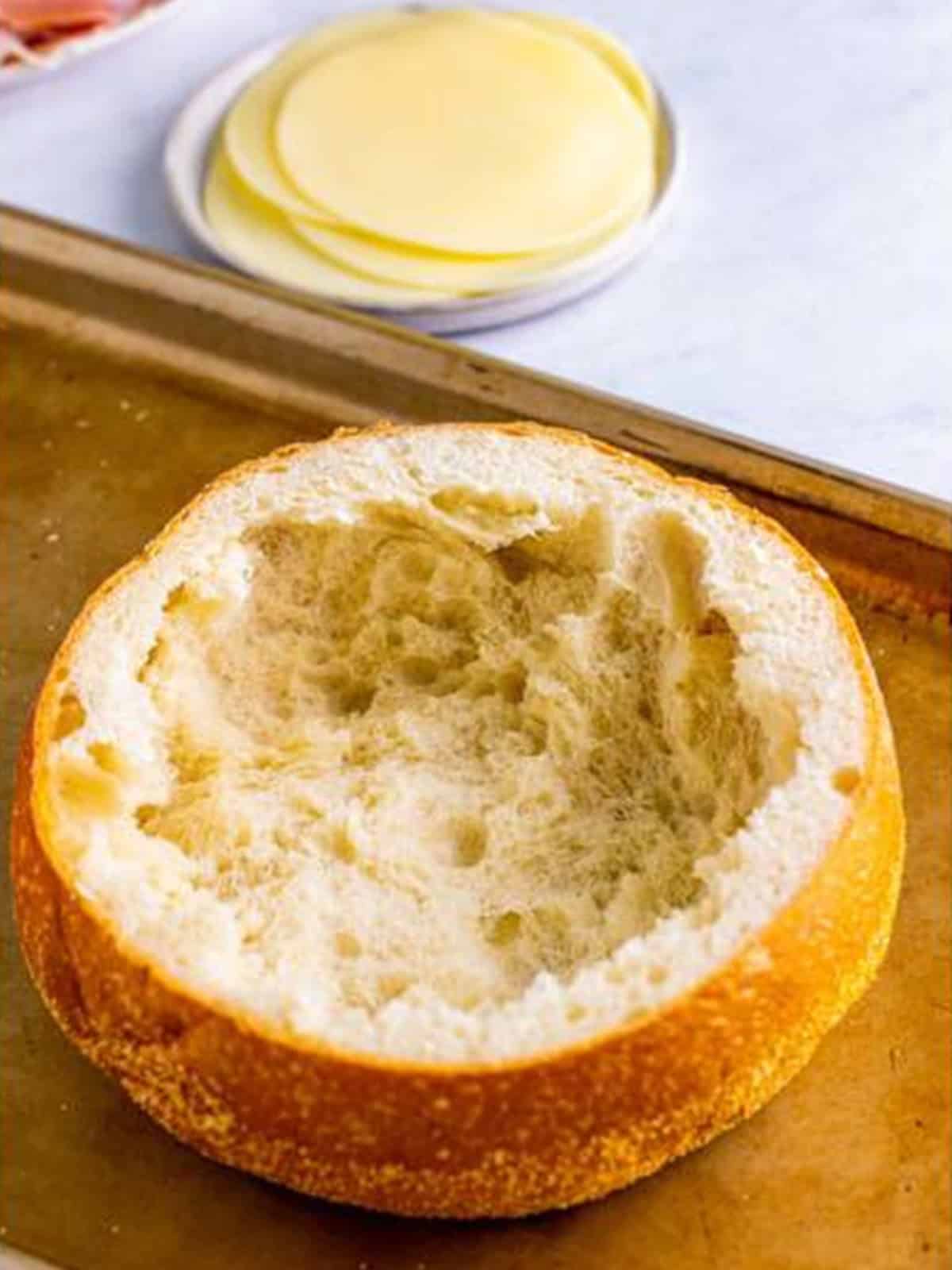 A round loaf of bread hollowed out to make a muffuletta sandwich.