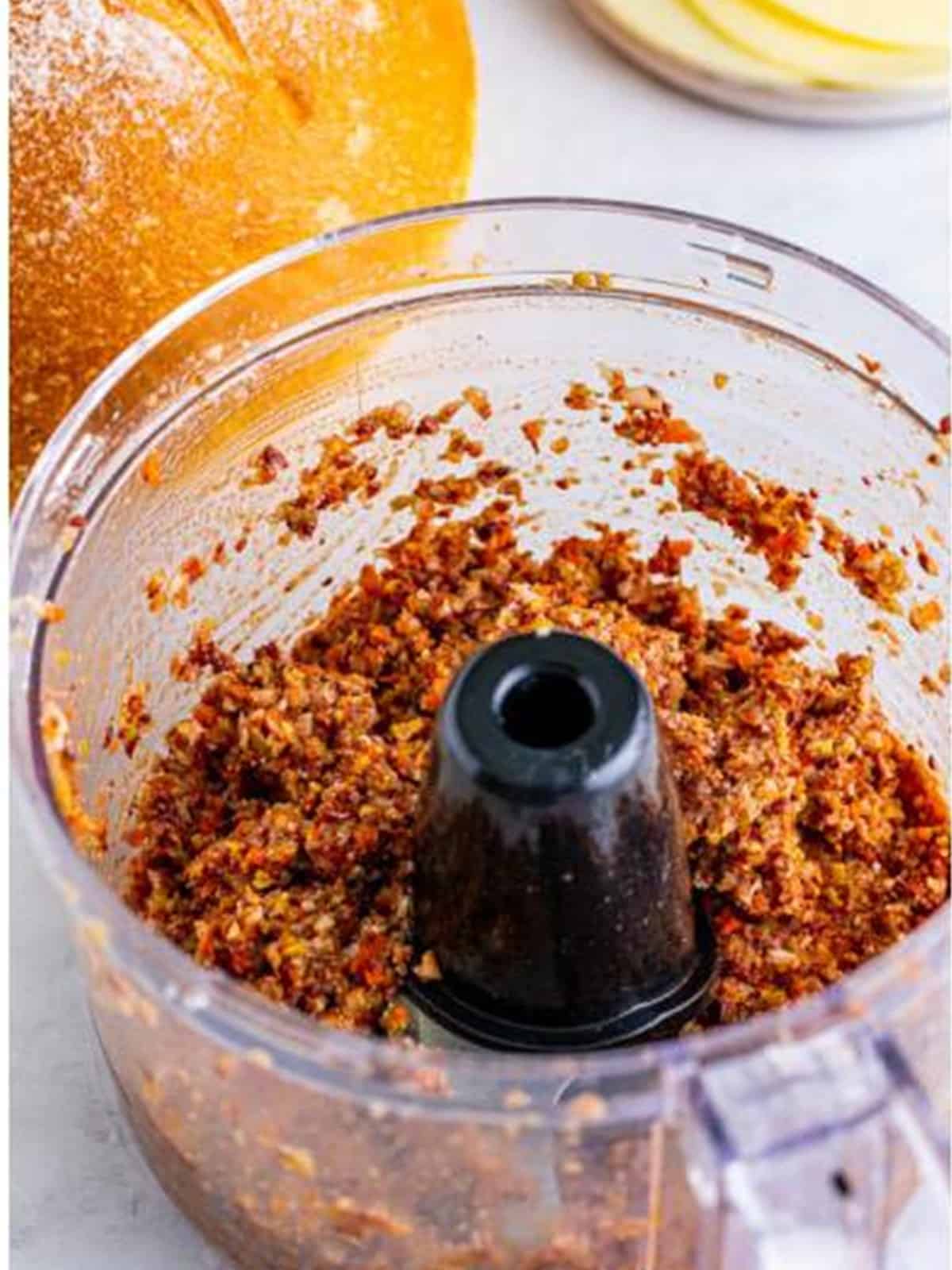 Giardiniera, green olives, and kalamata olives blended into an olive spread in a food processor.