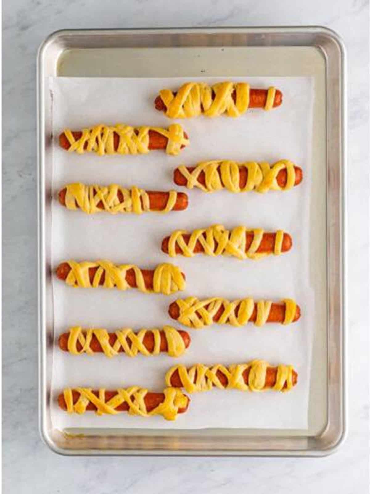 Mummy dogs baked until the crescent dough is golden brown.