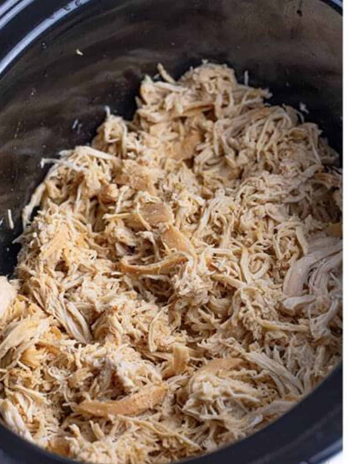 Shredded Nashville hot chicken in the slow cooker.