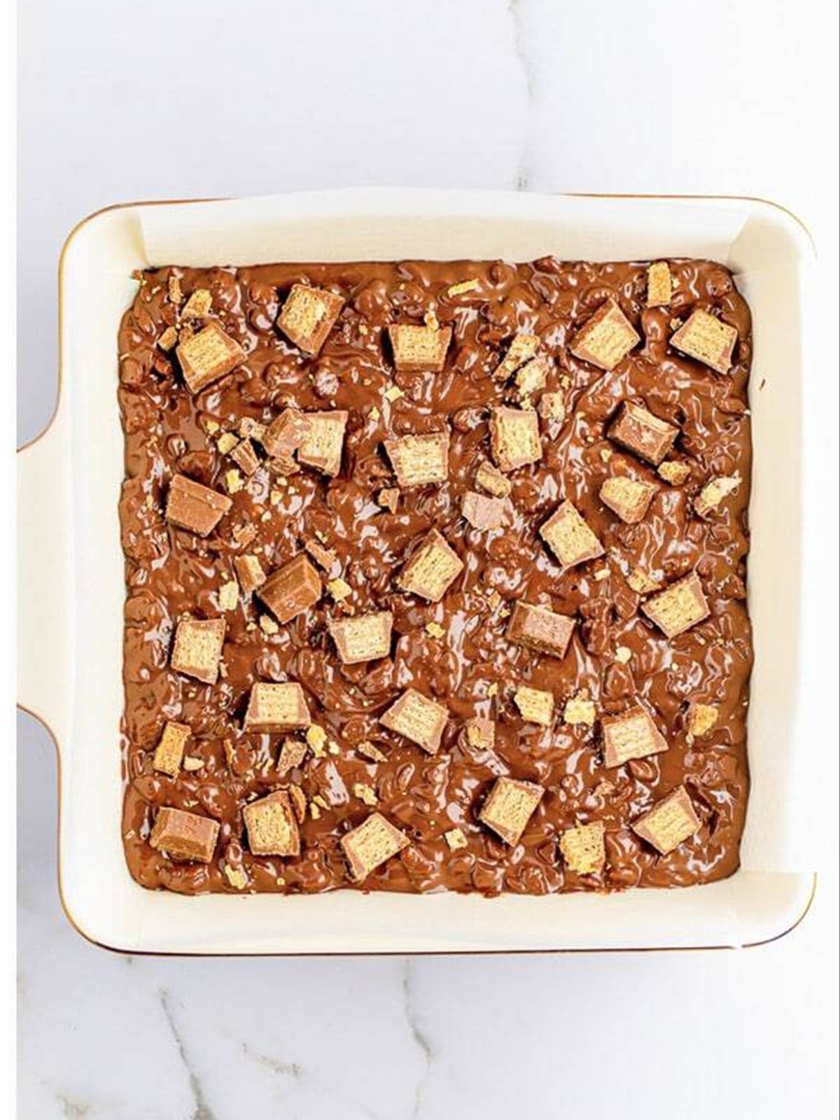 Chopped Kit Kats pressed into the top of the crunch bars.