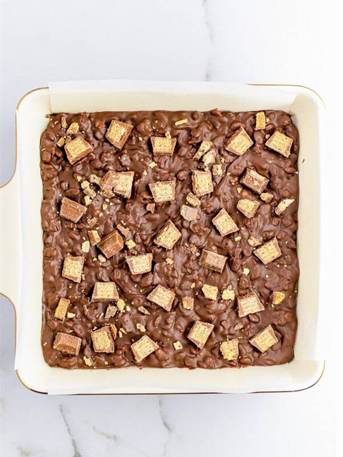 Set Nestle crunch bars in the pan after chilling.