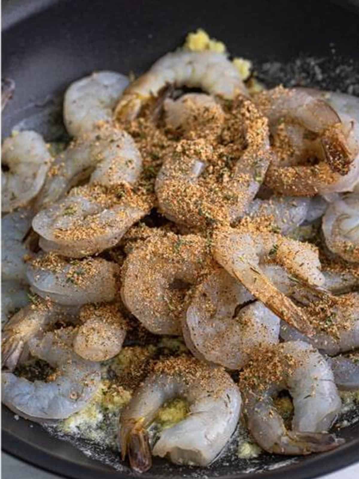 Shrimp tossed with the creole spice mixture in the buttery skillet.