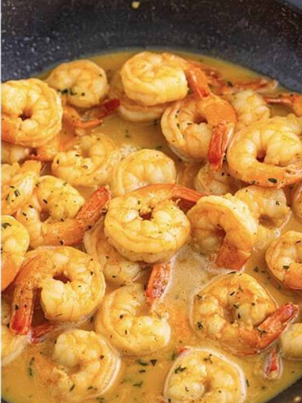 Finished New Orleans BBQ shrimp in a rich buttery creole sauce in the skillet.