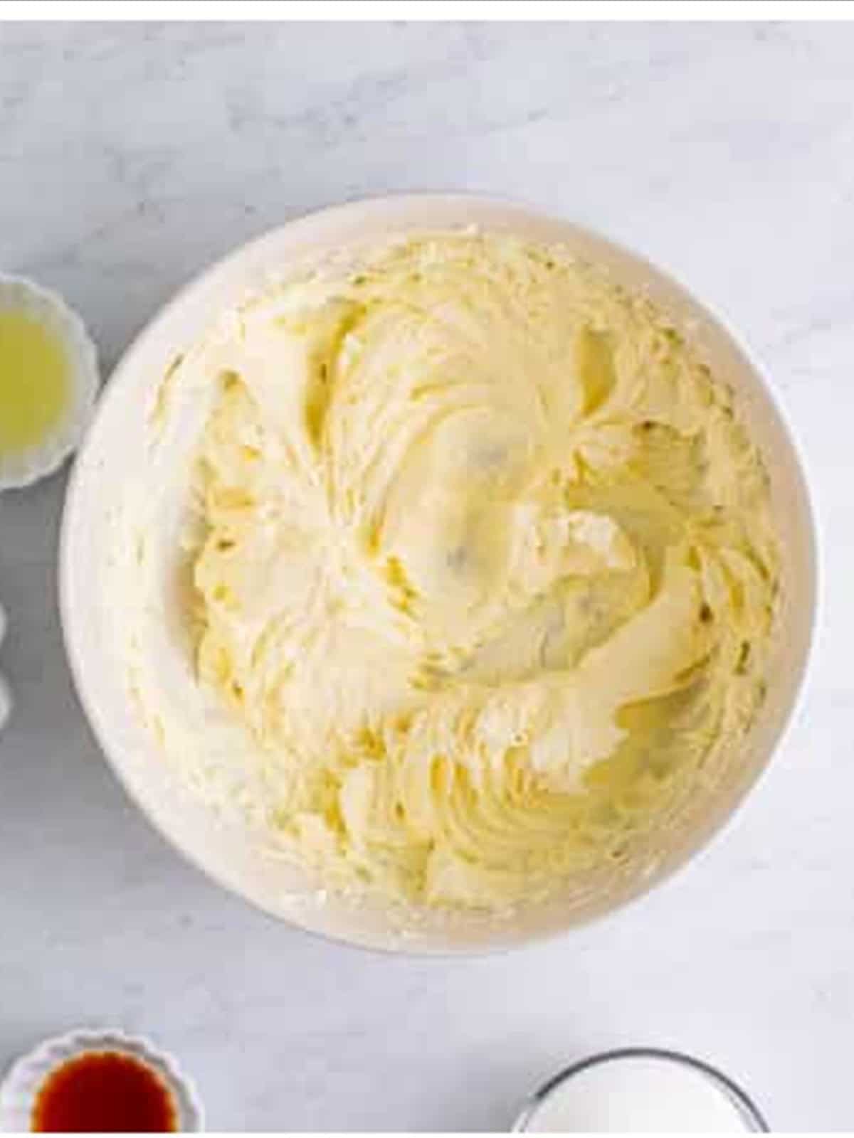 Whipping cream cheese until smooth for no bake cheesecake recipe filling.