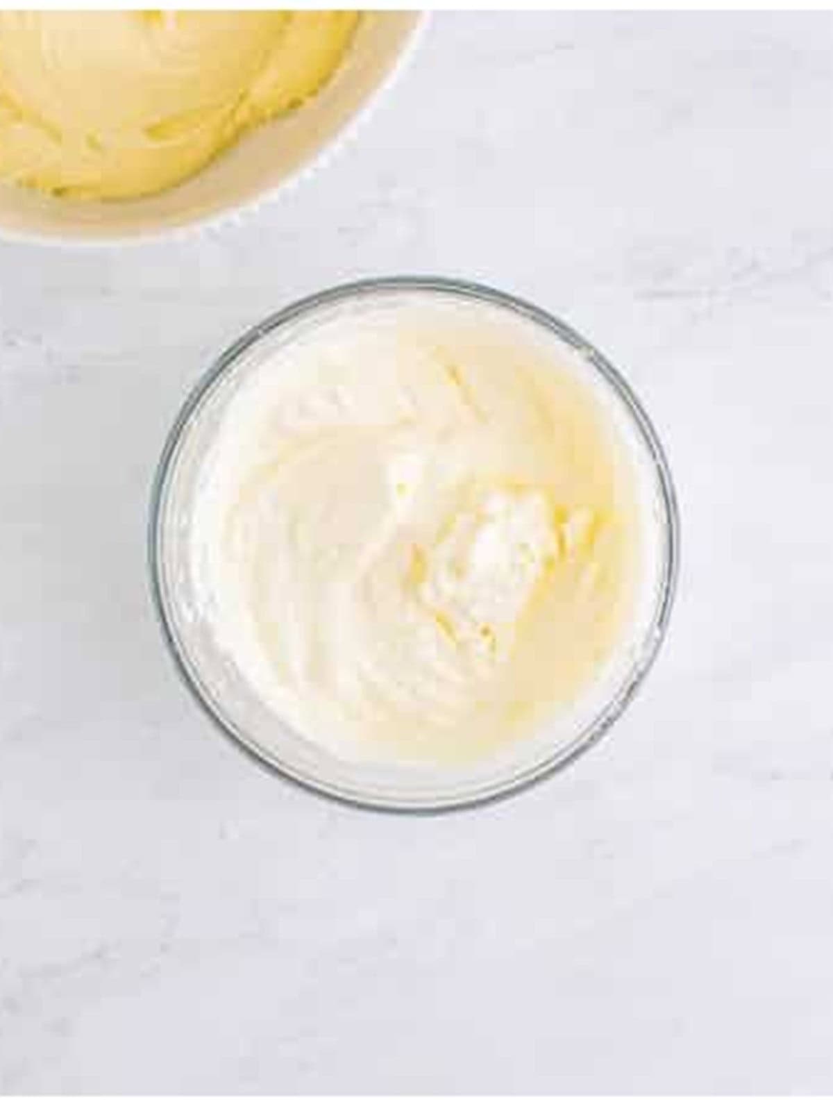 Heavy cream whipped to stiff peaks for no bake cheesecake recipe.