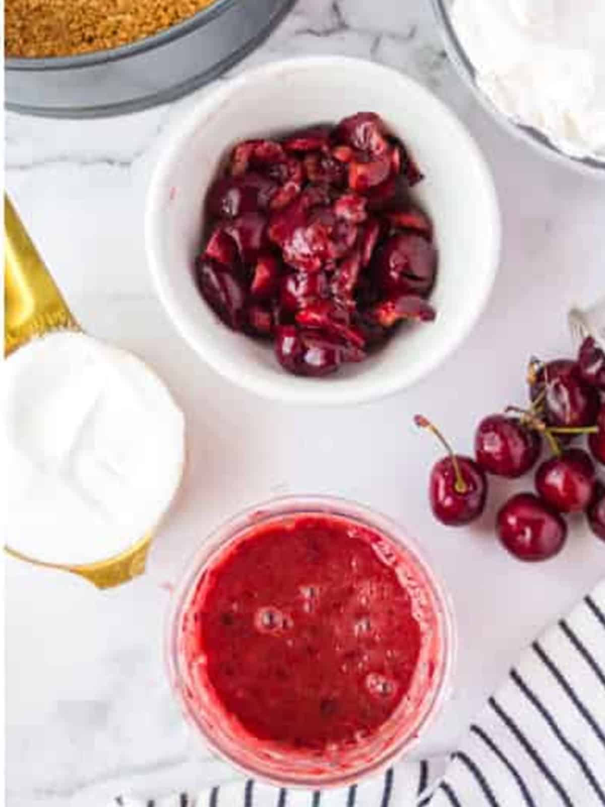 Chopped fresh cherries and blended cherry puree for cherry cheesecake.