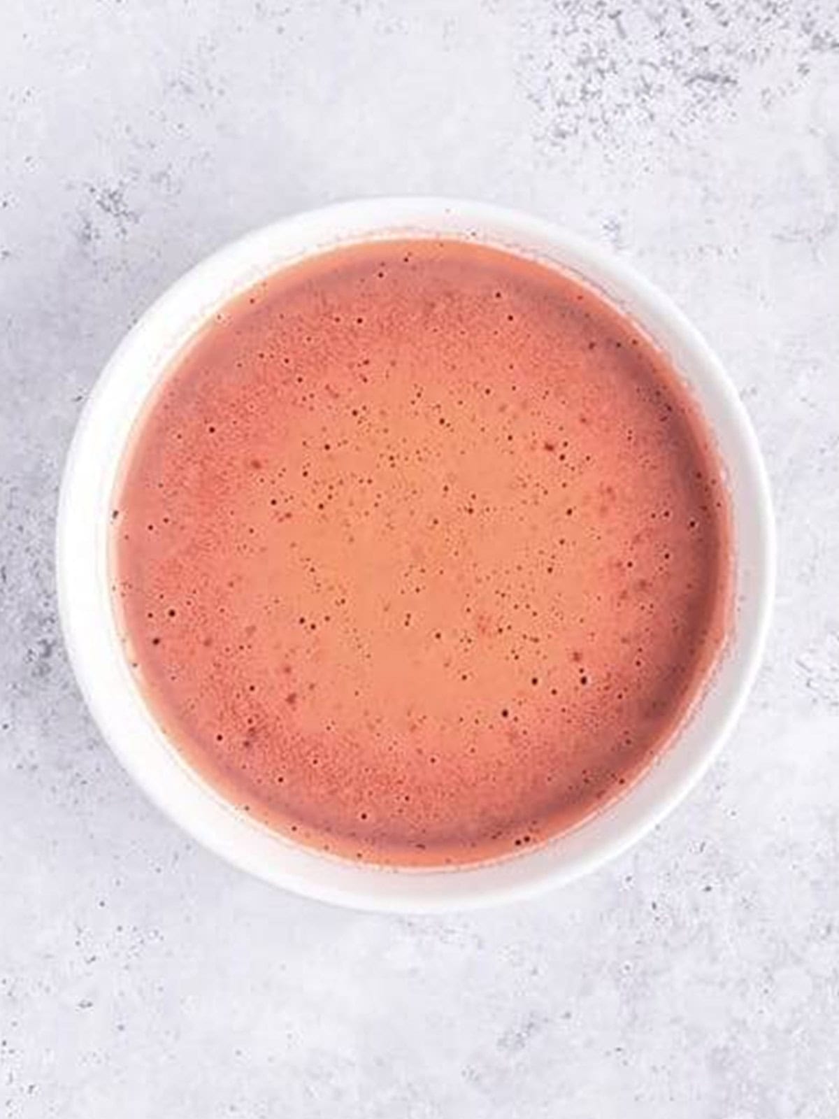 The mixed non alcoholic jello shot liquid in a bowl ready to pour.