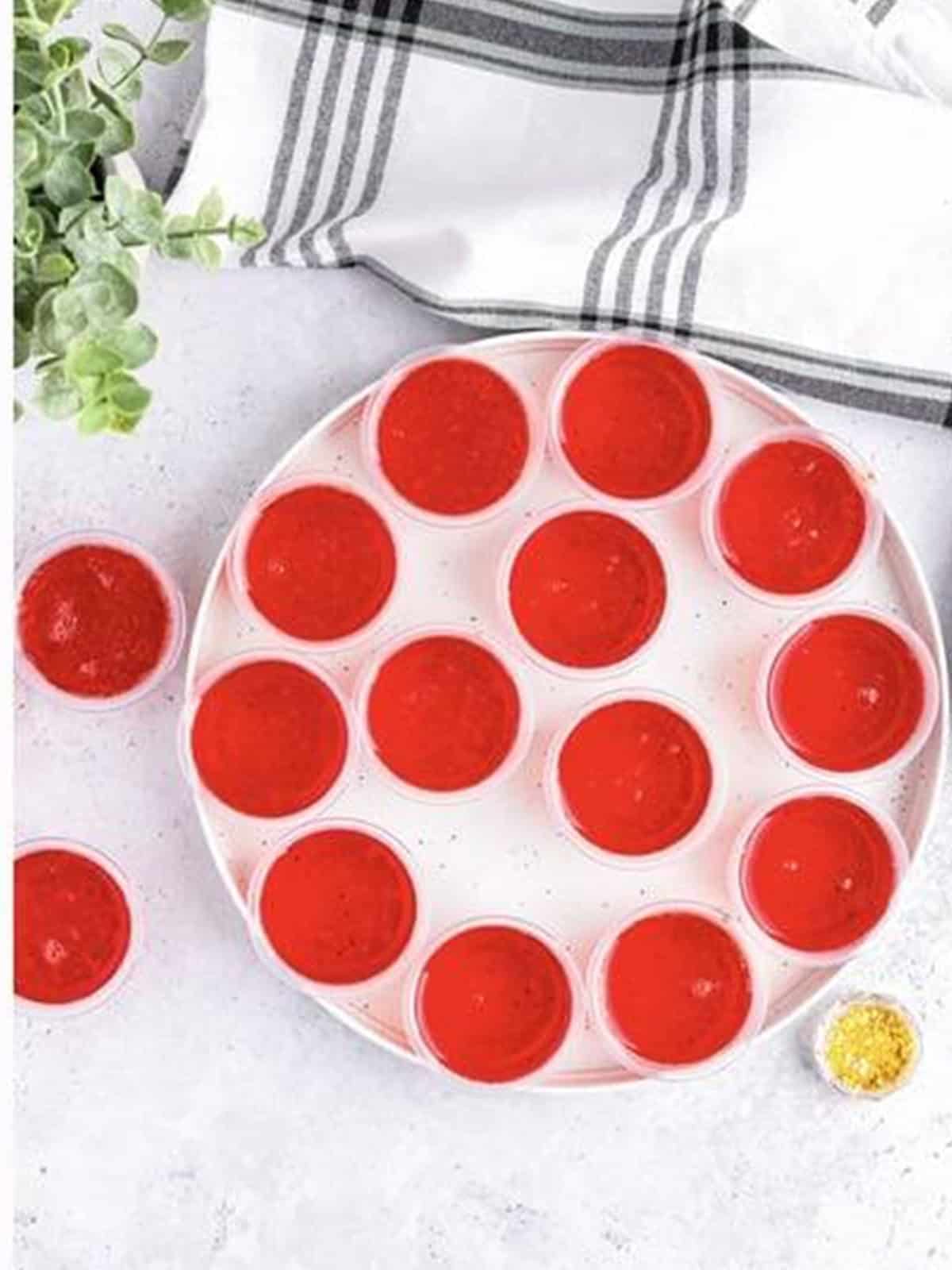 Filled non alcoholic jello shots set on a tray ready to chill.