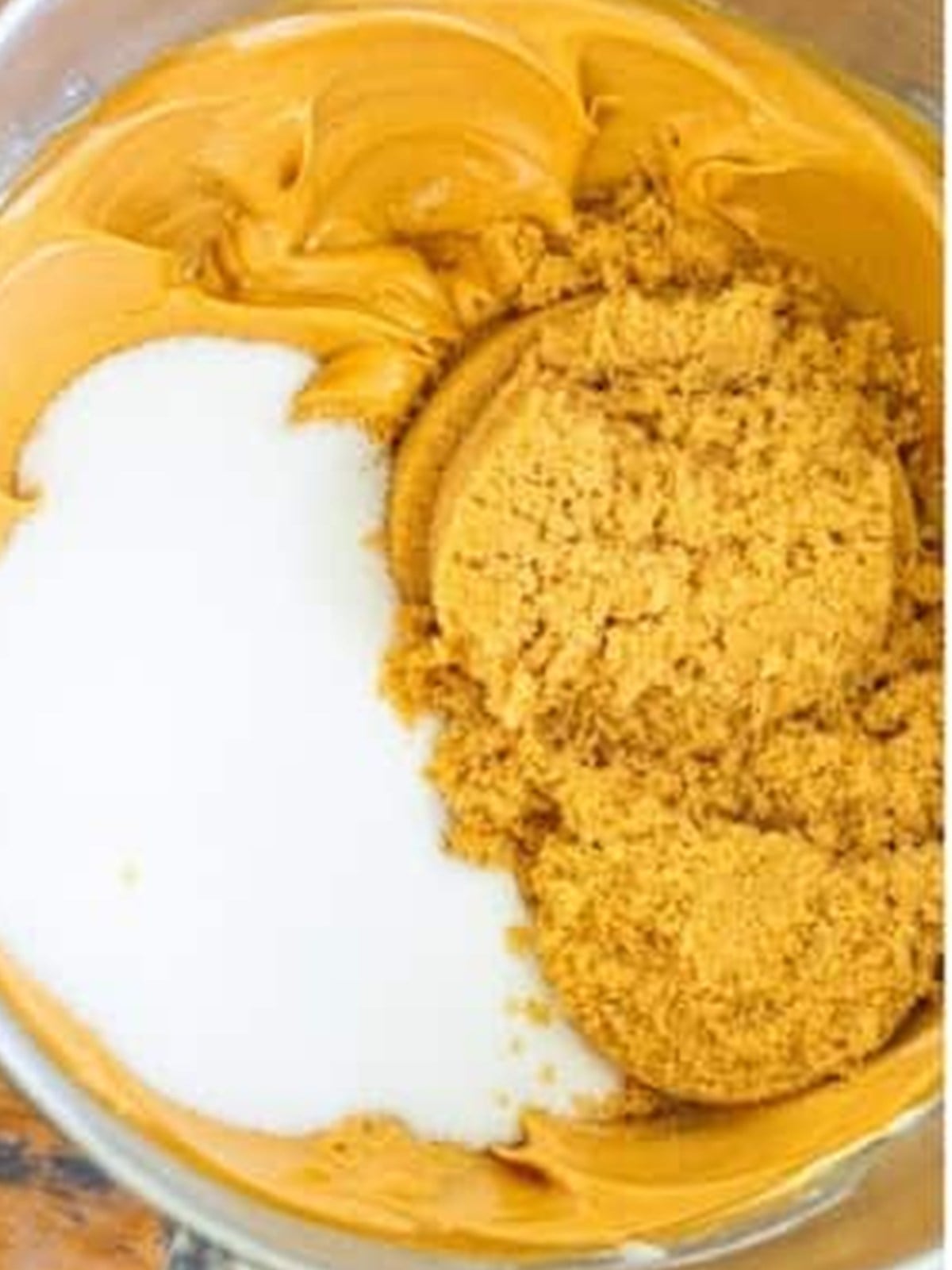 Creaming peanut butter, butter, and sugar in a mixing bowl for nutter butter cookies.
