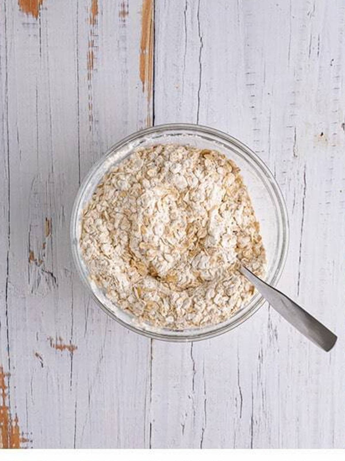 Whisking together the oats, flour, and leaveners in a glass bowl.