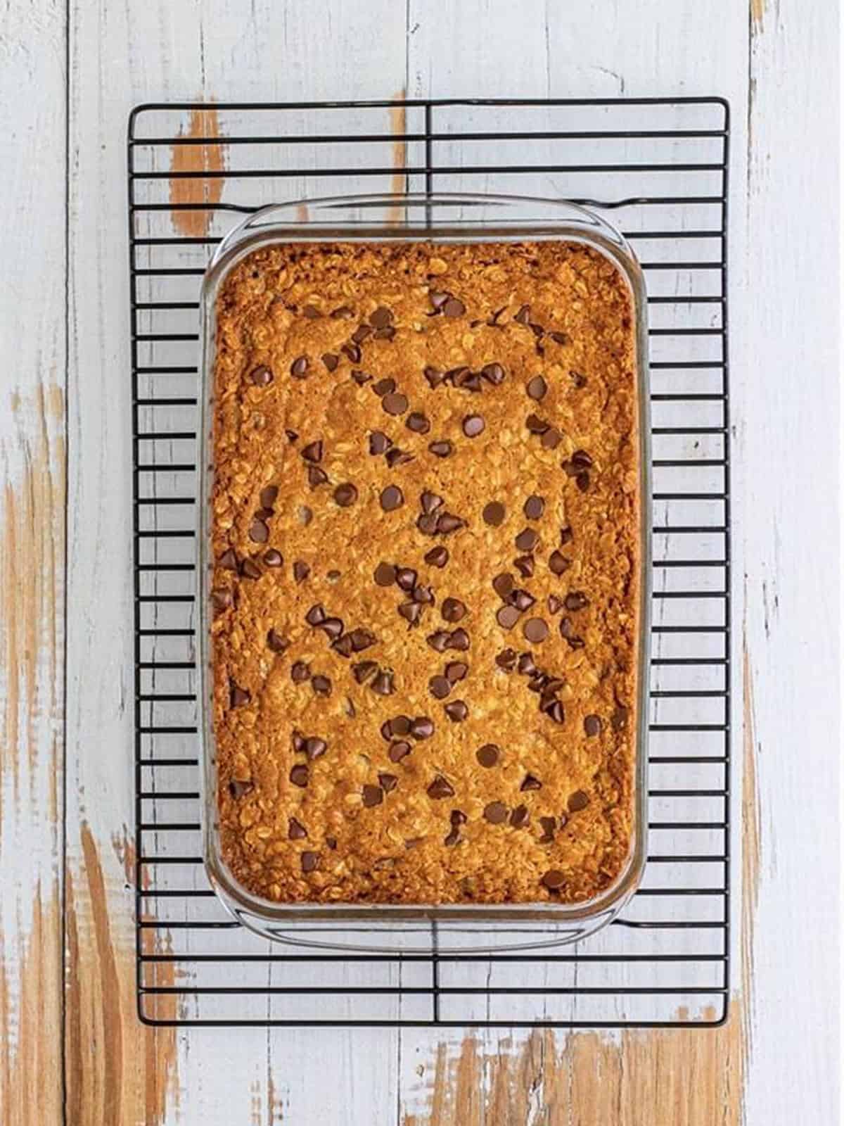 Baked oatmeal chocolate chip cookie bars golden brown in the pan.