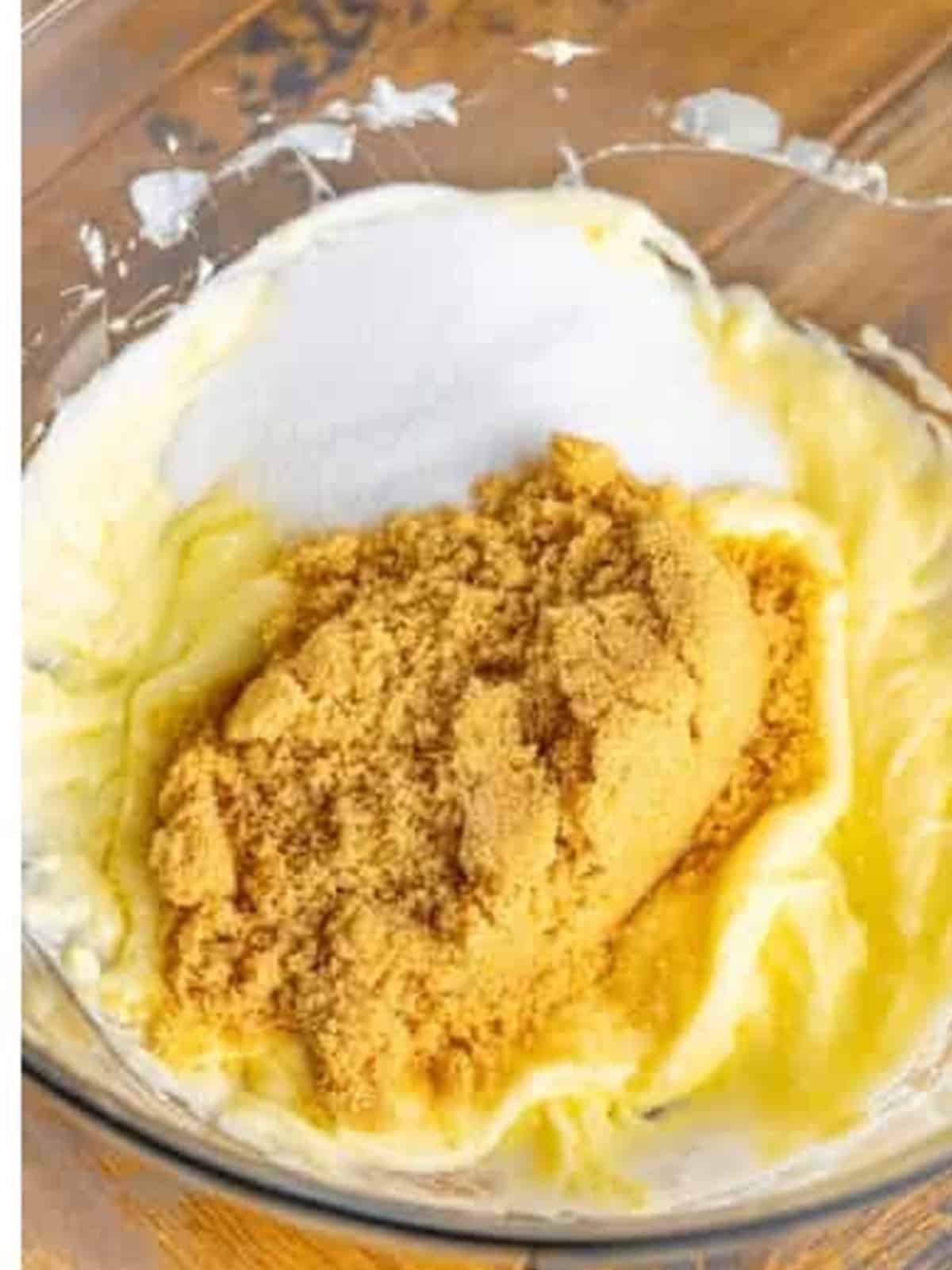 Brown sugar and granulated sugar added to creamed butter for caramel cake batter.