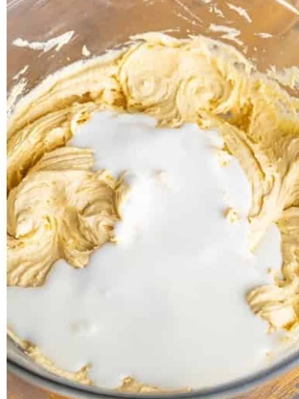 Buttermilk stirred into the caramel cake batter.